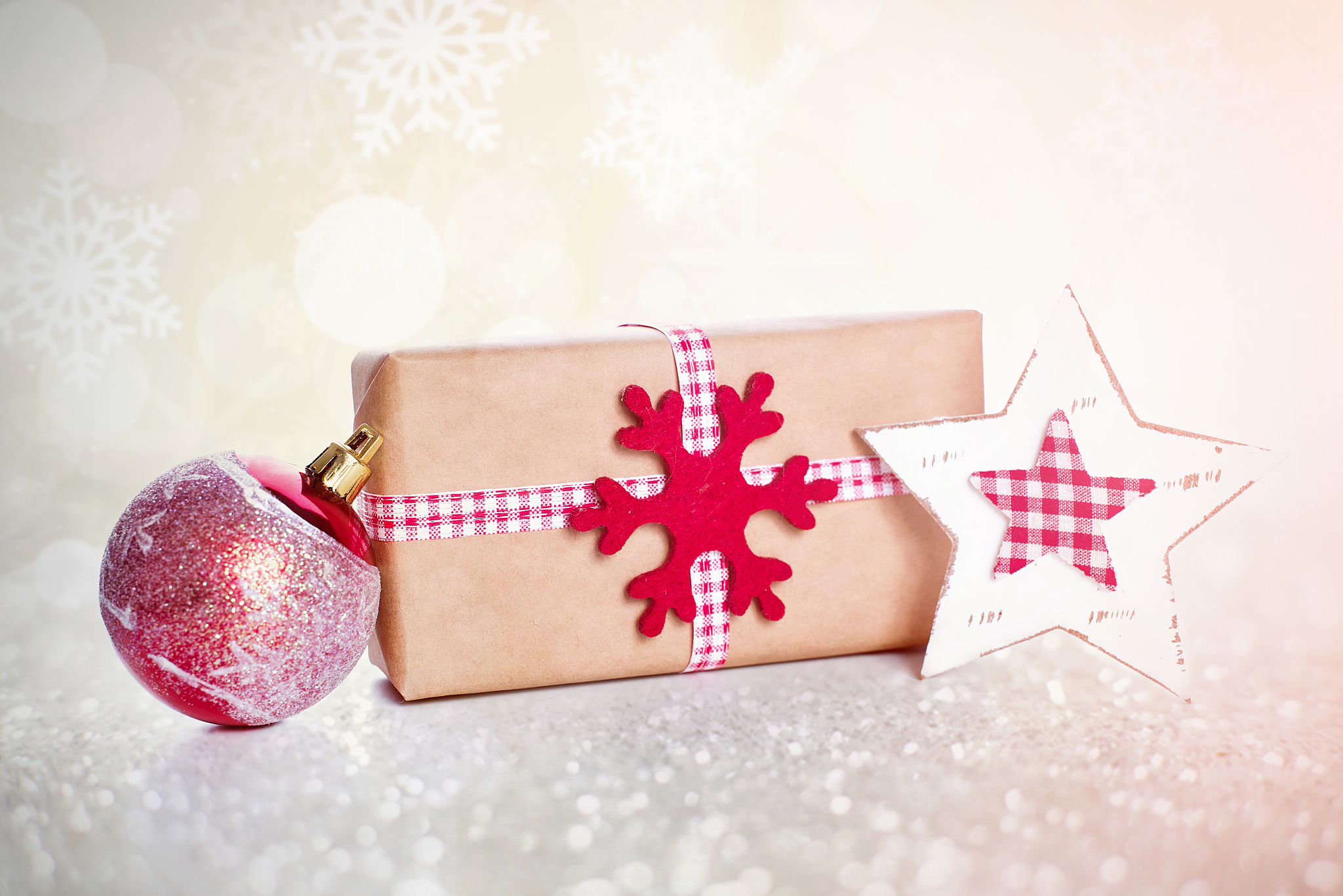 christmas background with decorations and gift boxes on wooden b