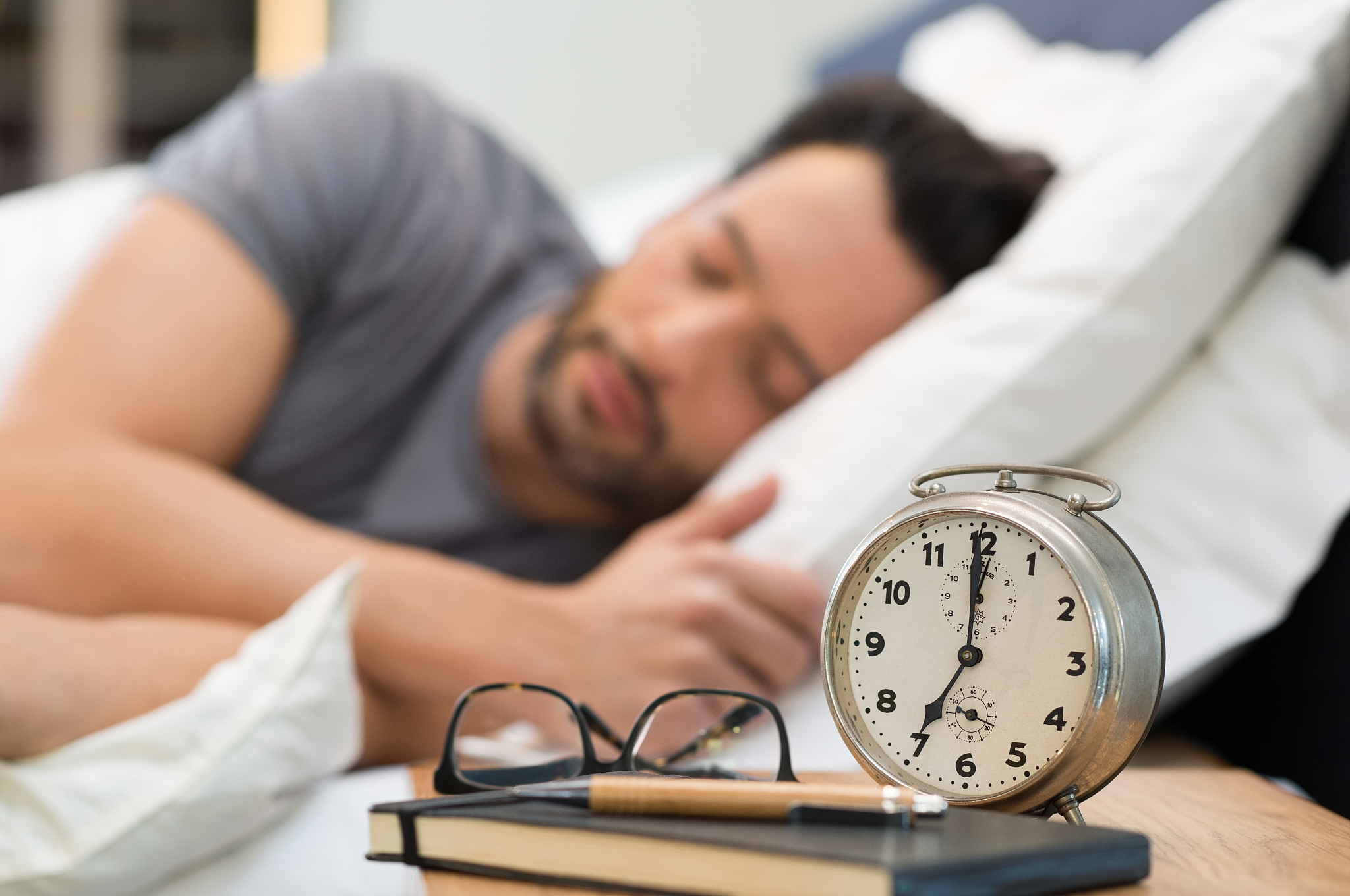 man sleeping in bed