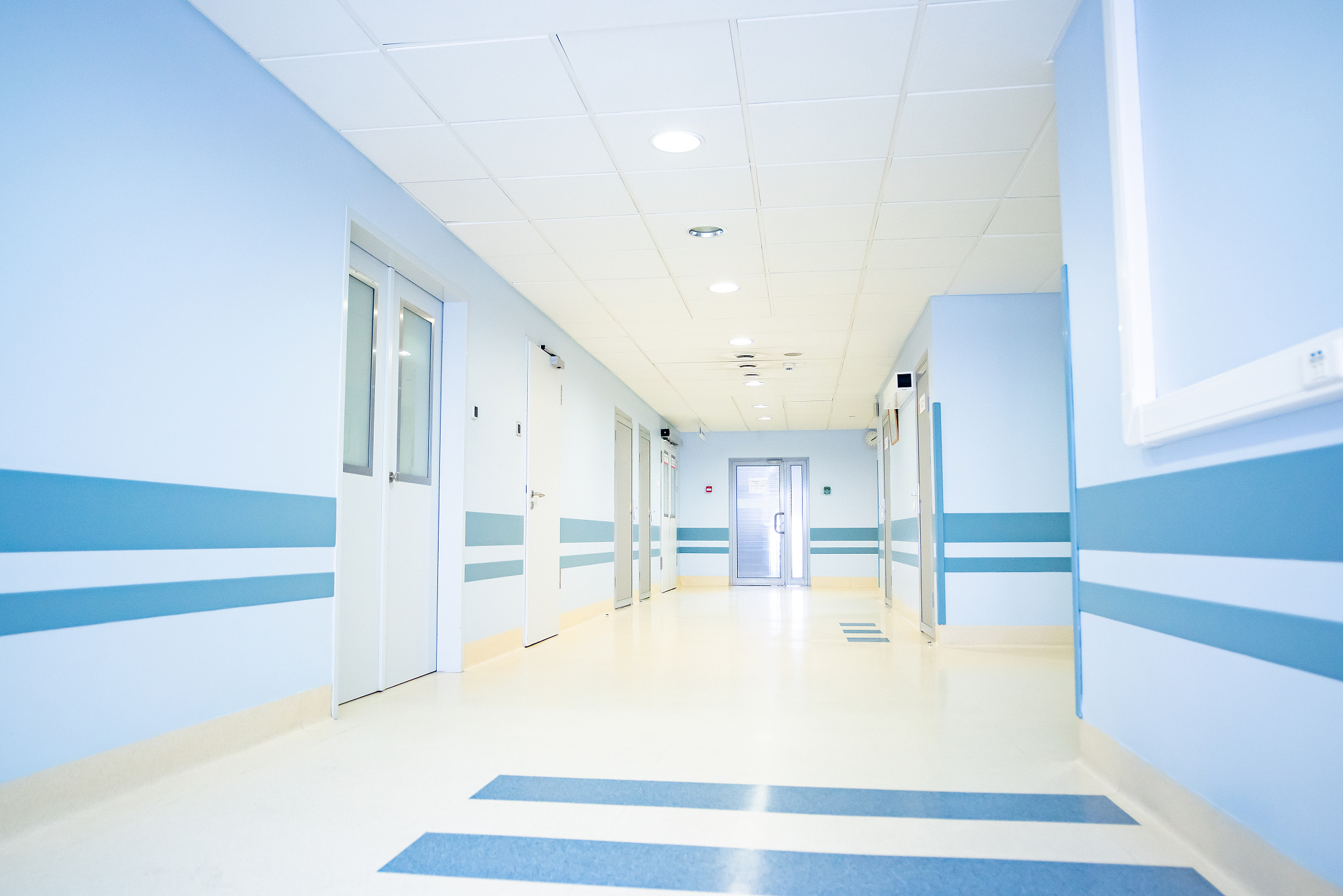 a long light corridor in a modern hospital
