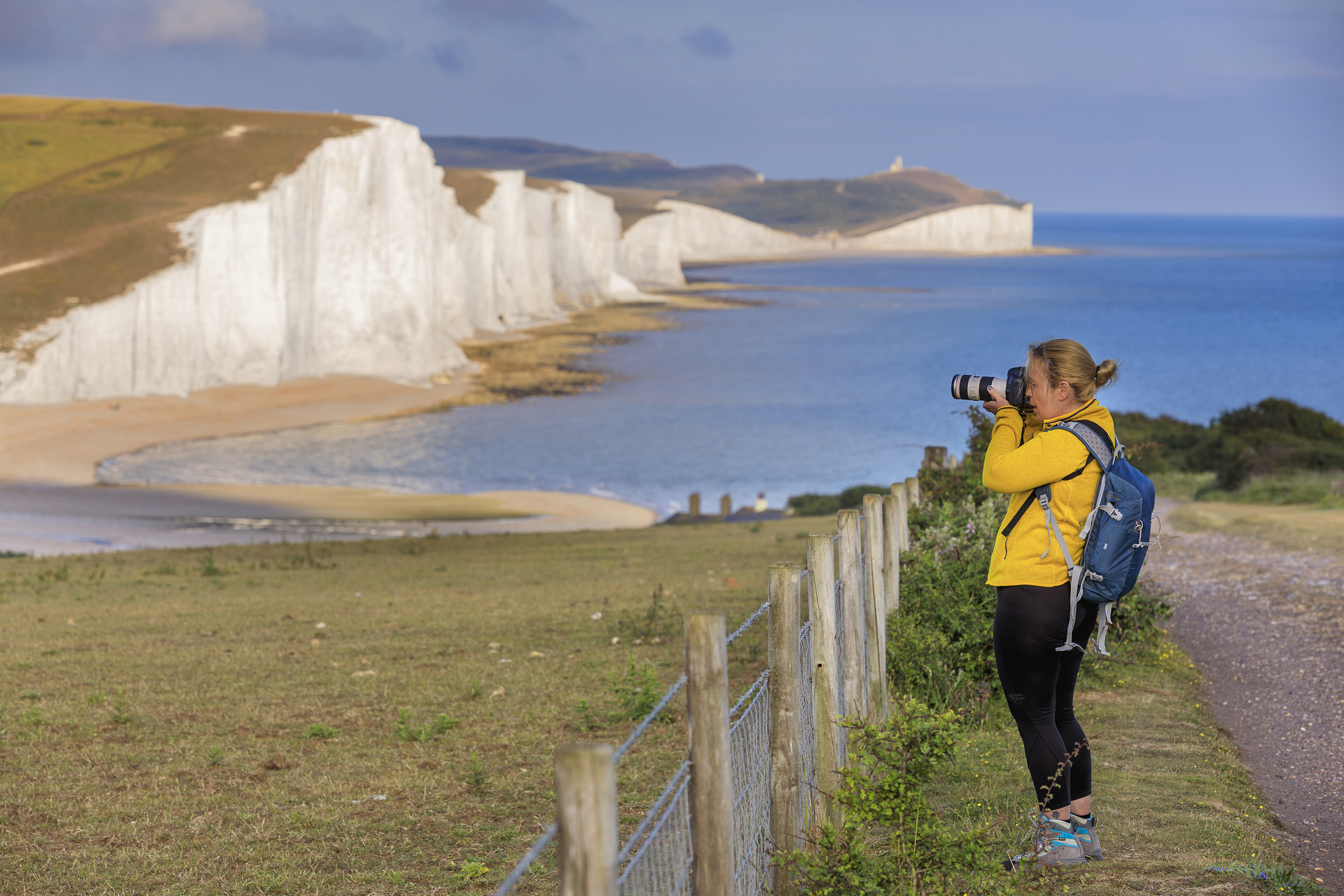 woman using dslr camera