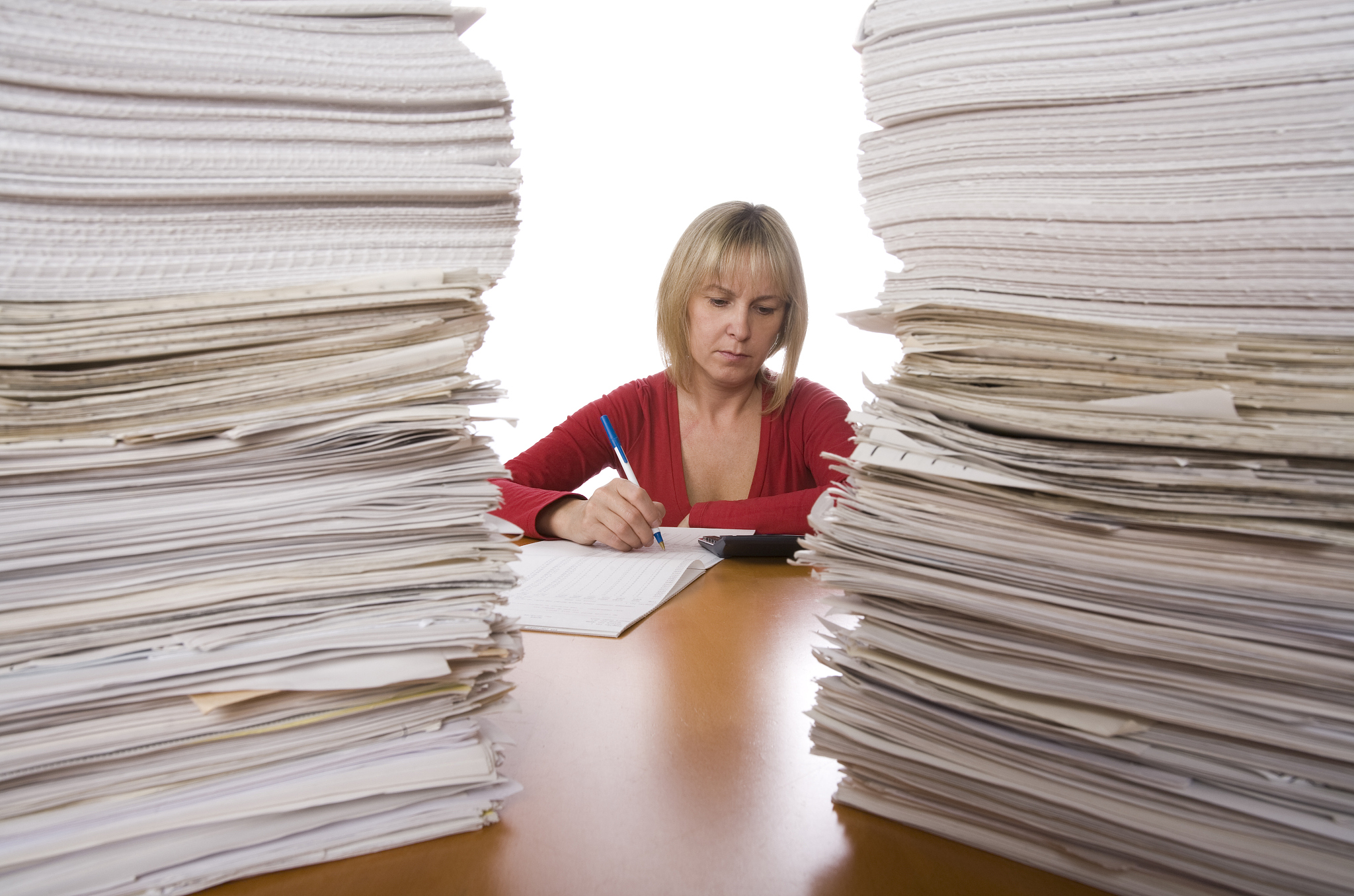 hard worker and stack of papers