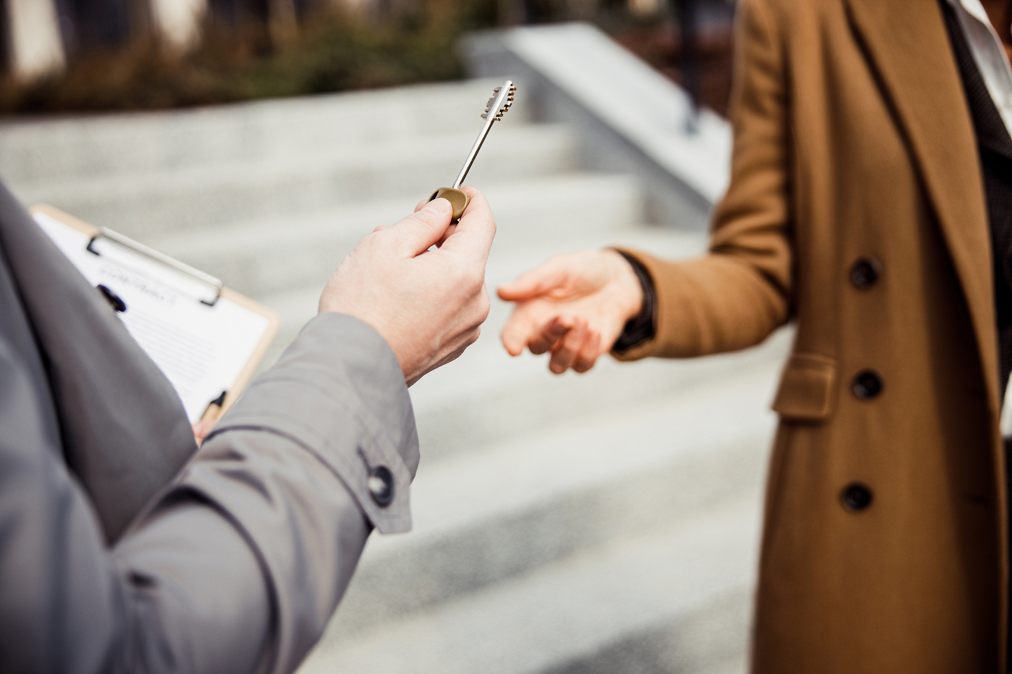 male broker standing next to a client