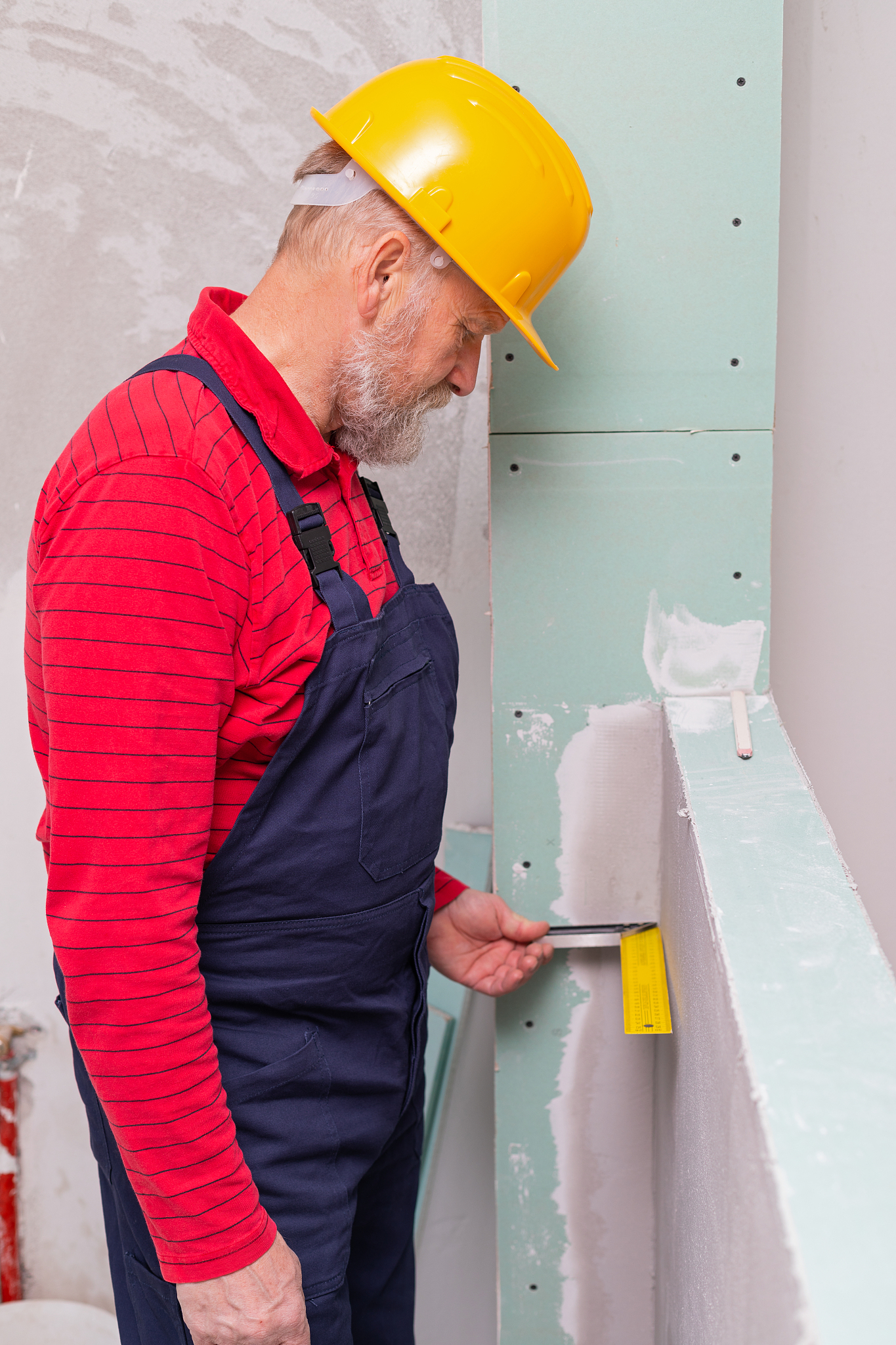 senior worker filling in the walls