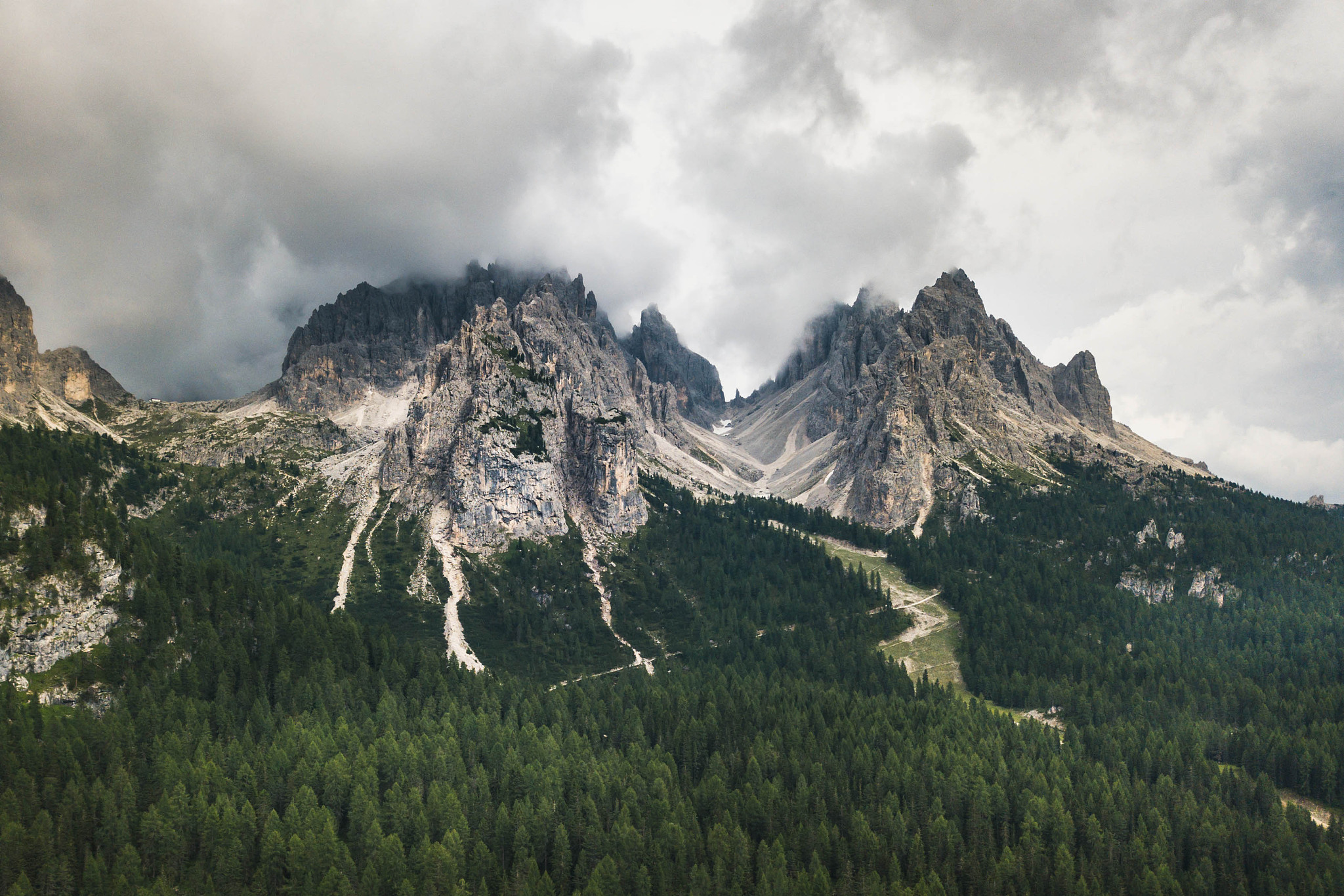 moody picture of cadin di misurina mountains, covered in clouds 