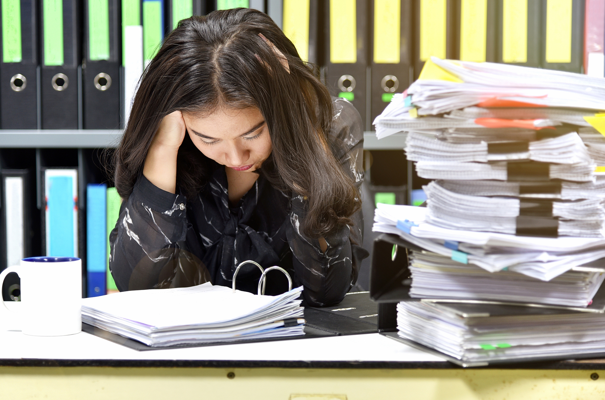 work hard, lot of work, stacks of document paper and files folde