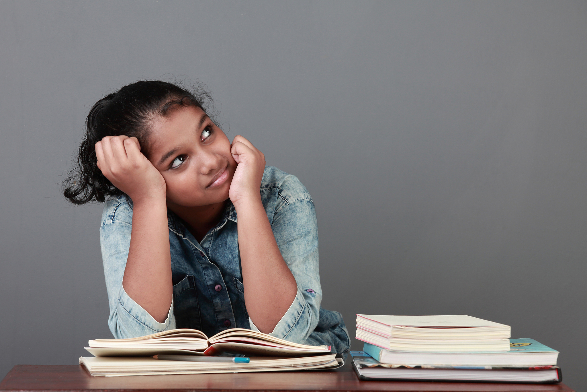 young girl with her books in the study room