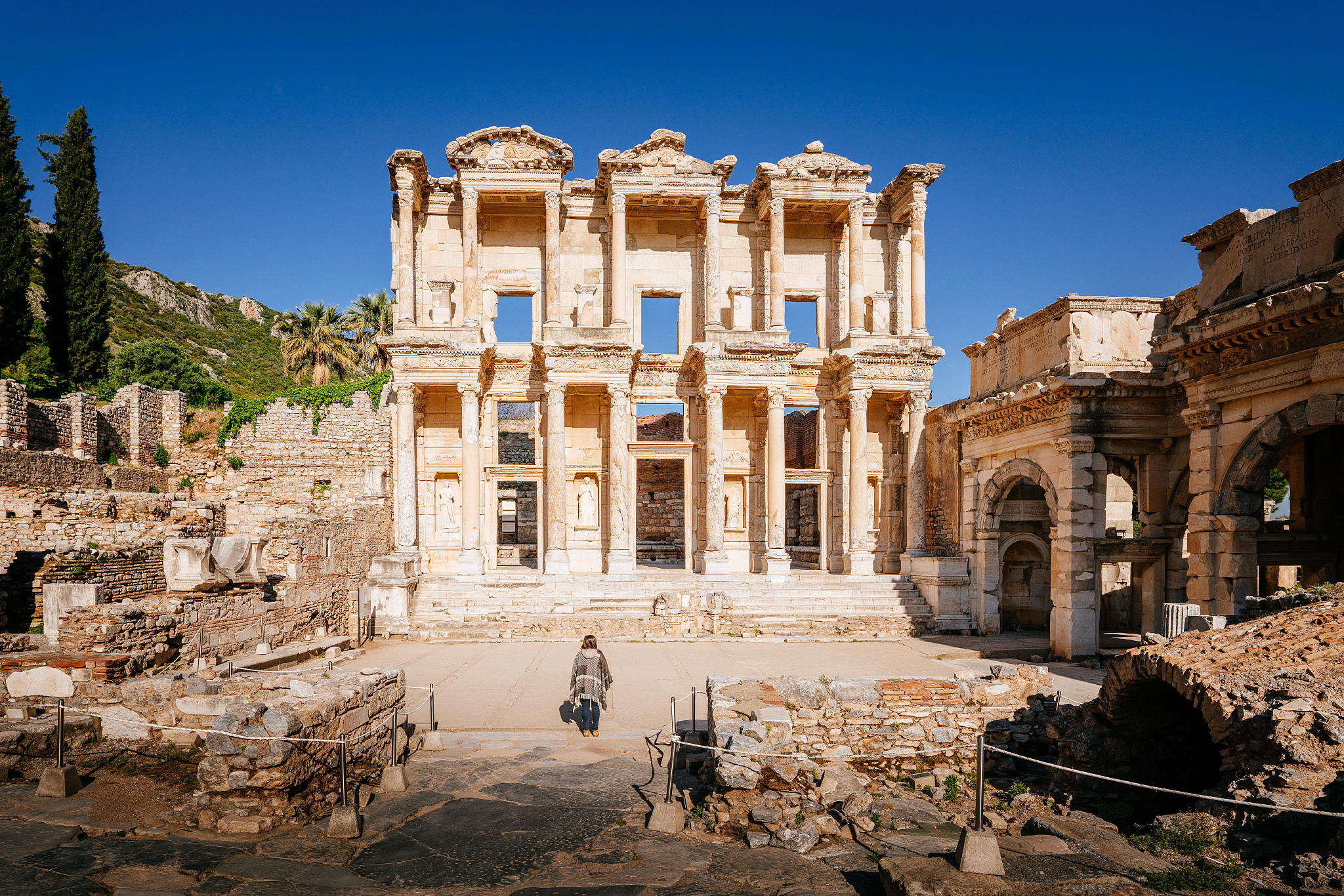 ephesus, library of celsus. turkey. woman looking at ruins