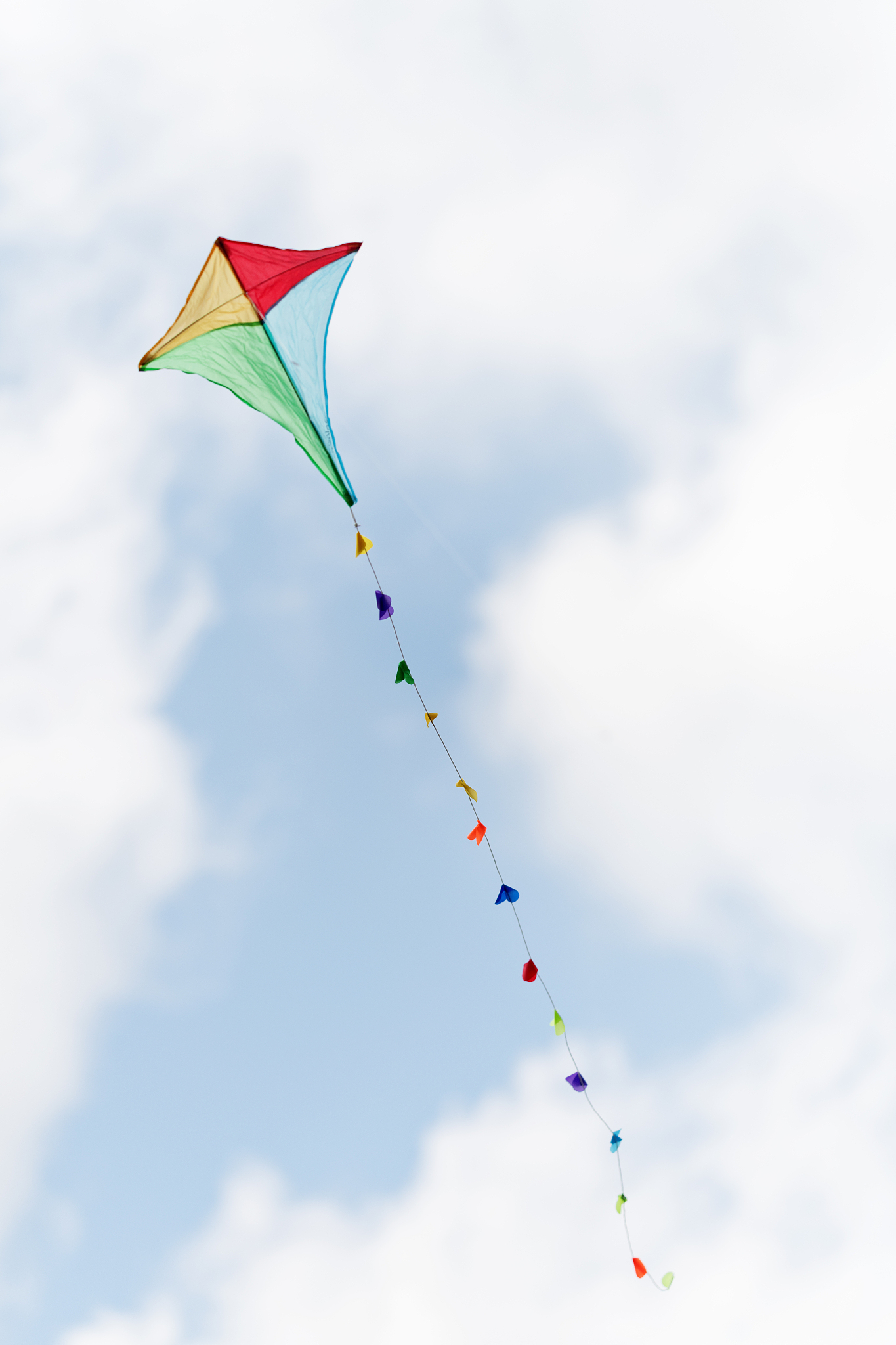 colorful kite in a cloudy sky