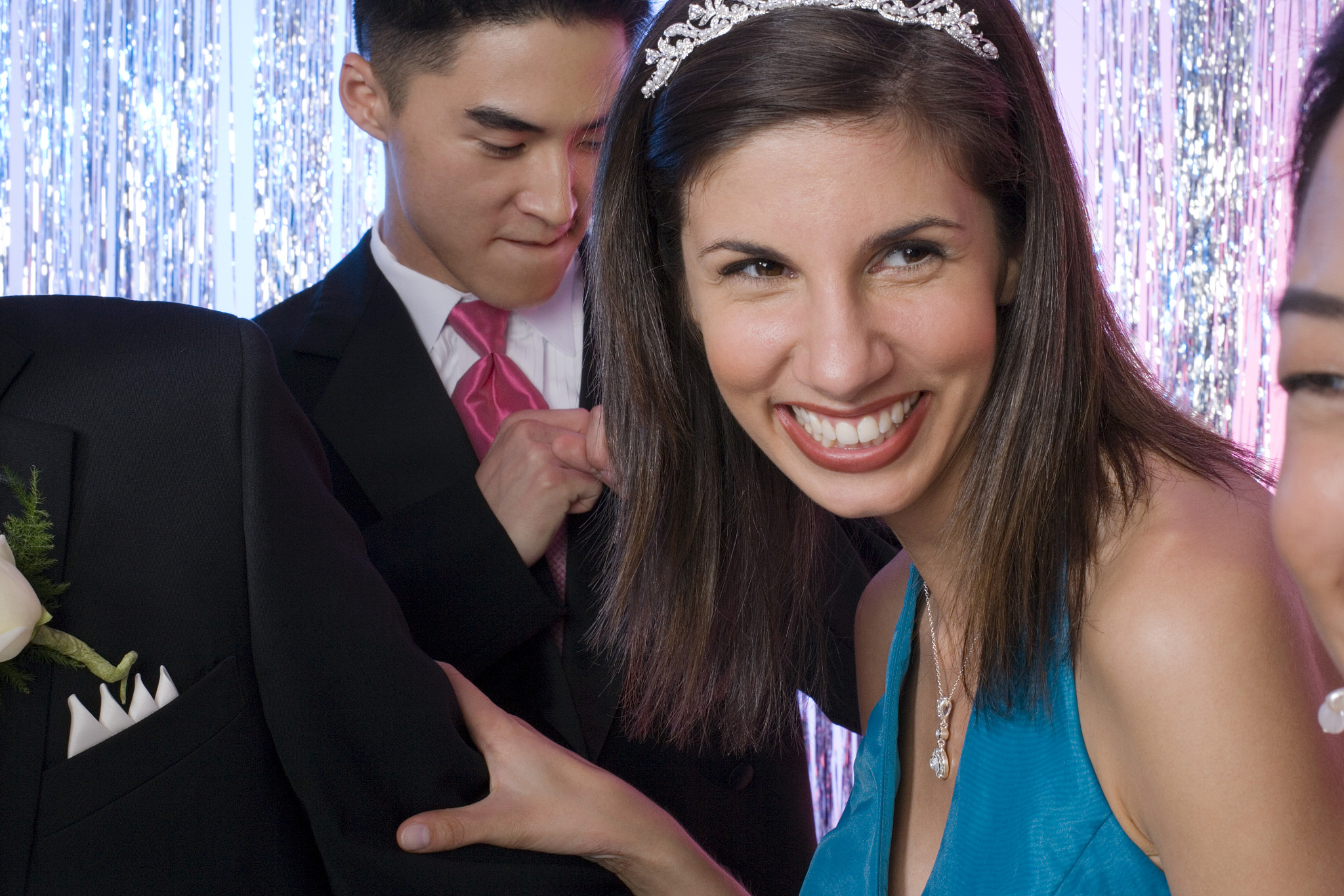 prom queen and two boys dancing