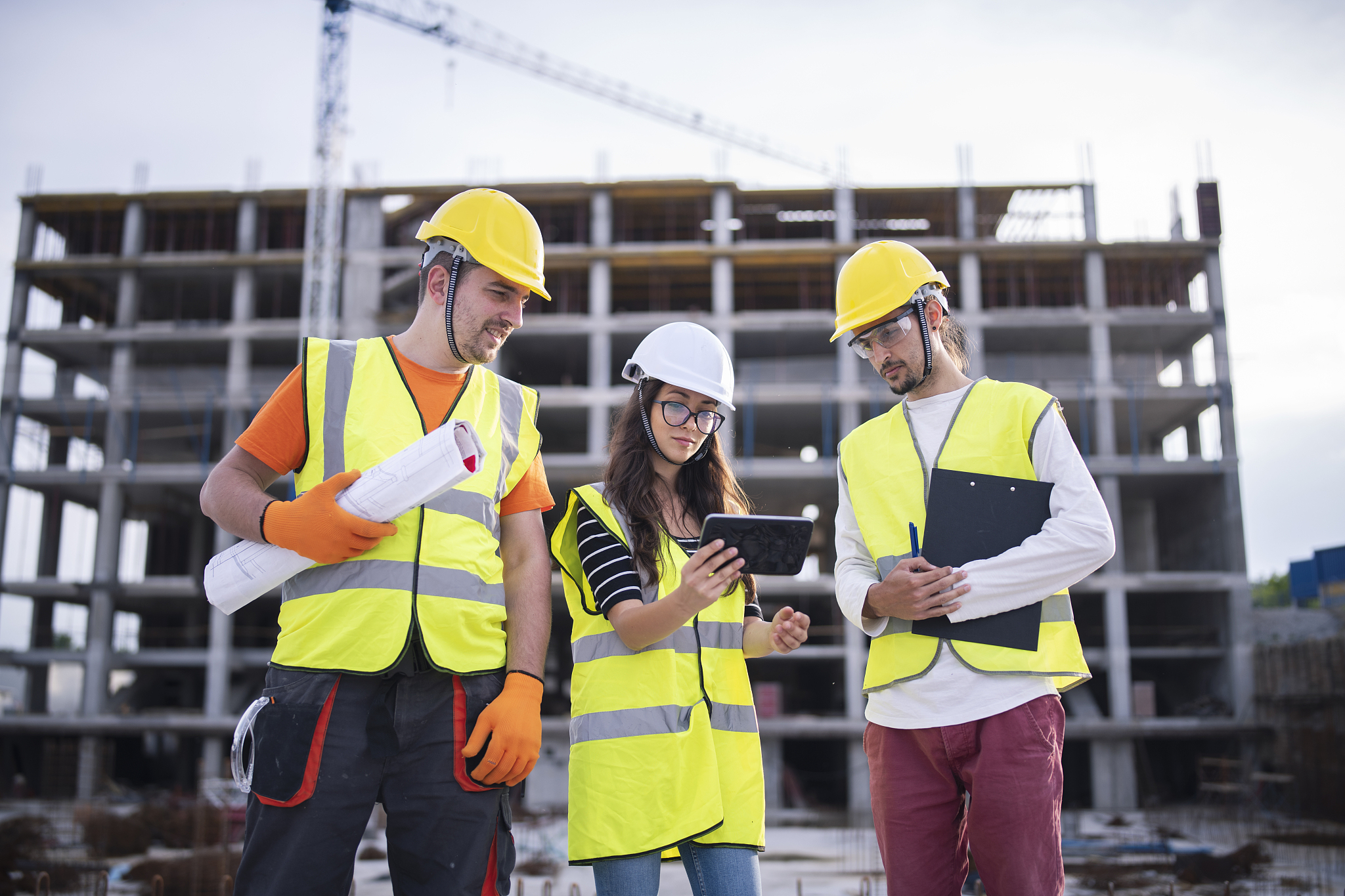 architects teamwork on construction site, they using digital tab
