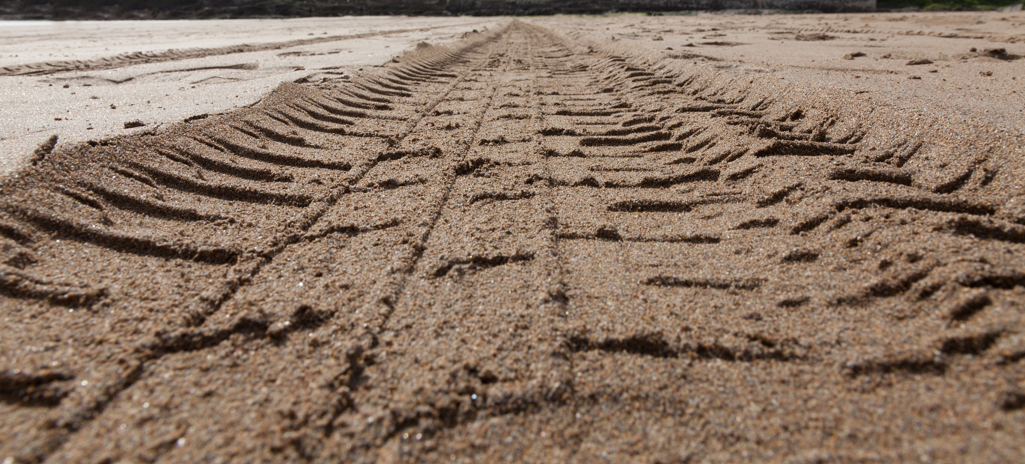 tyre treads in the sand