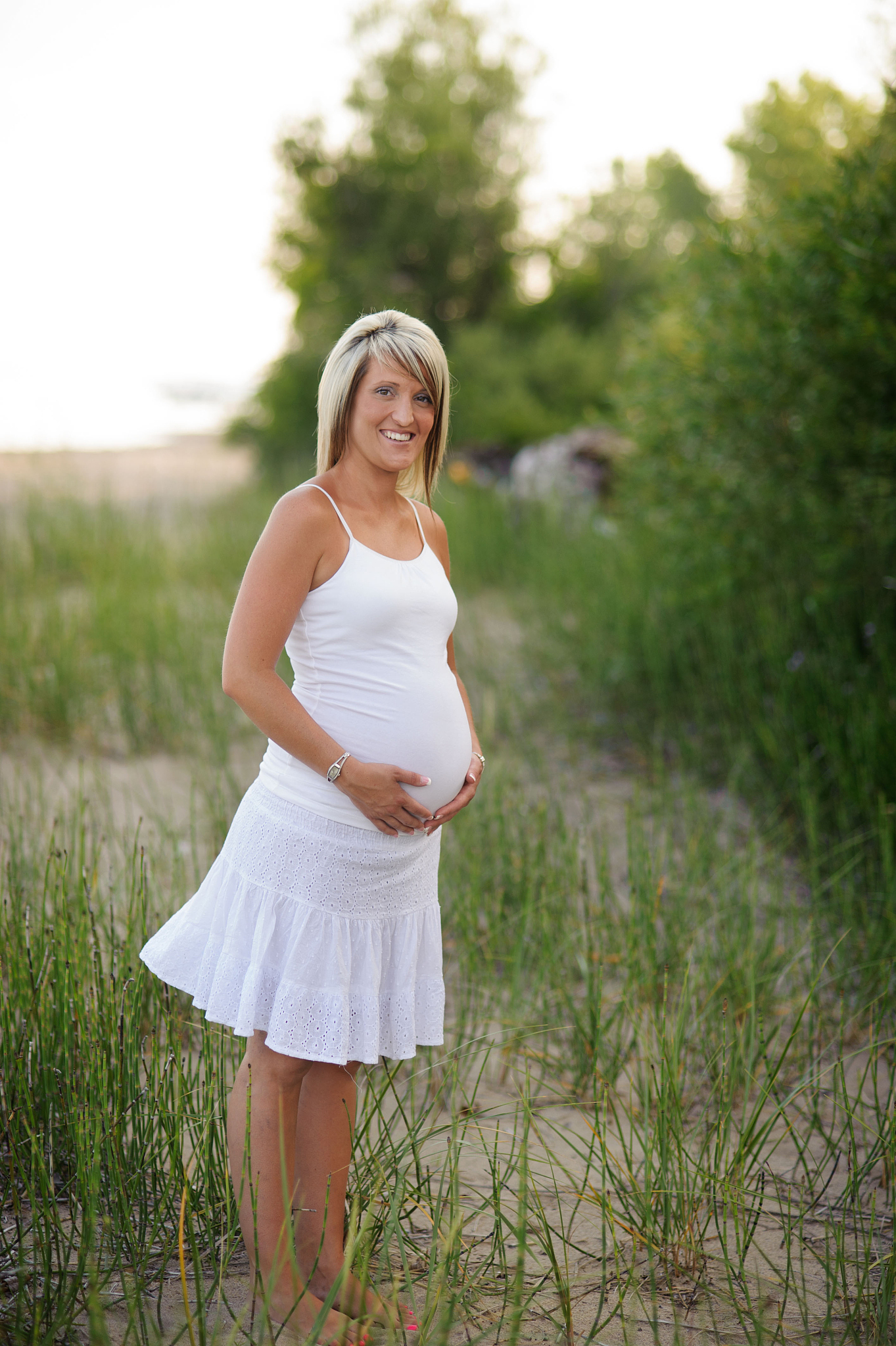 pregnant mother standing outside