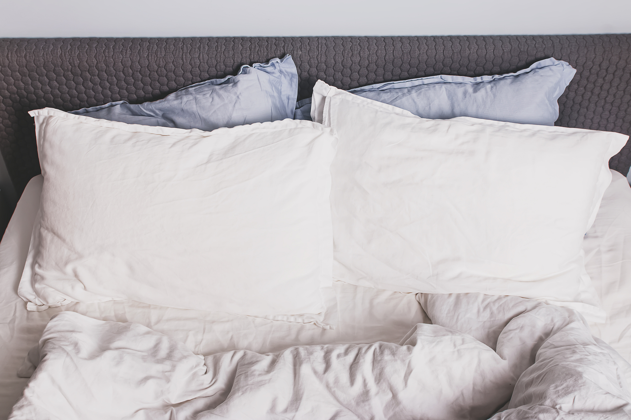 messy bed with two pillows close-up,