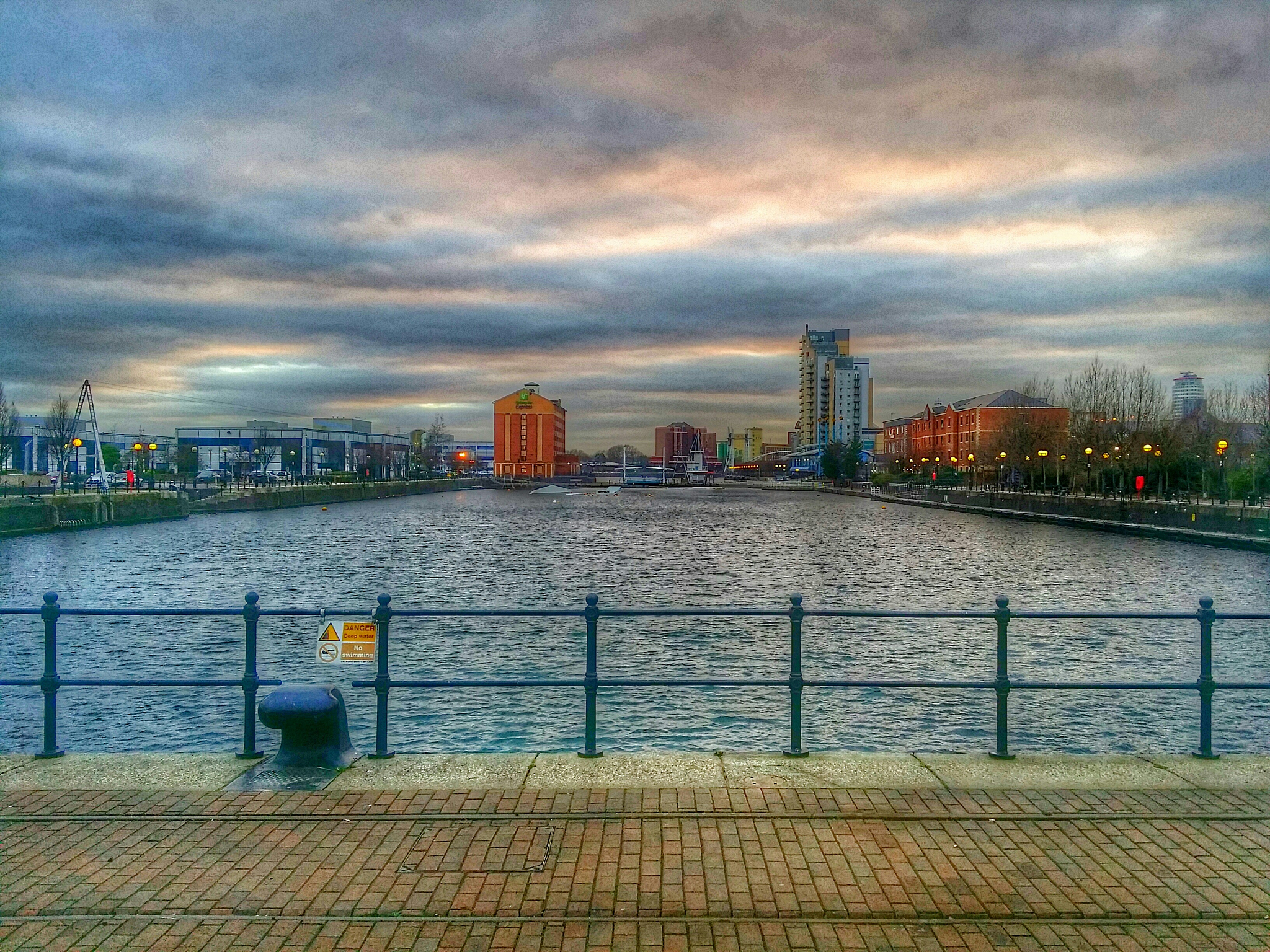 empty harbor basin at gloomy sunset