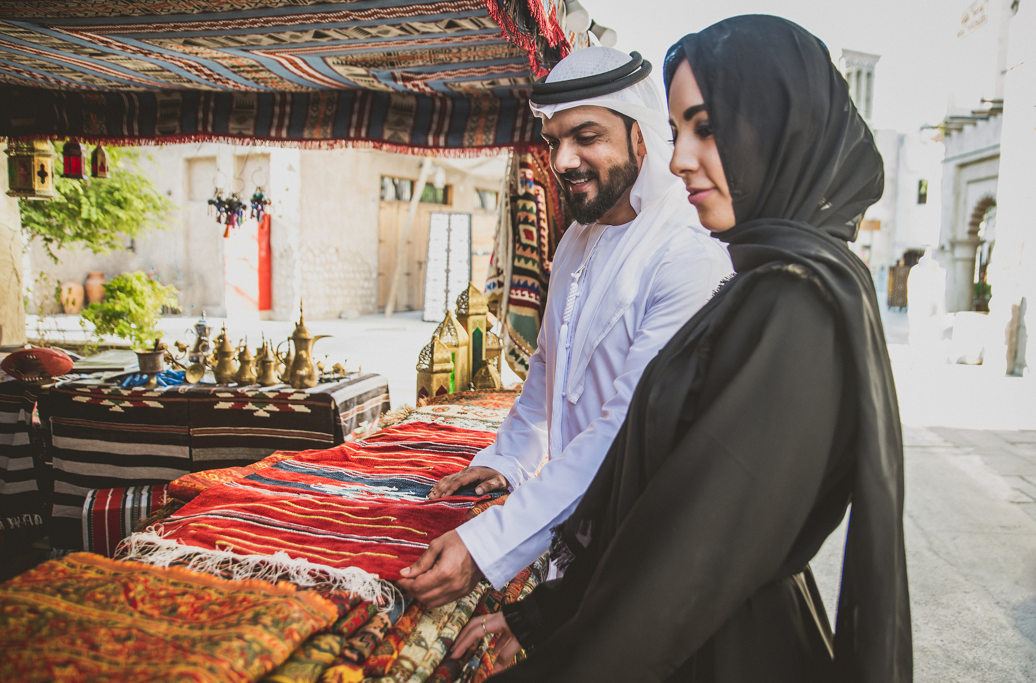 happy couple spending time in dubai. man and woman wearing tradi