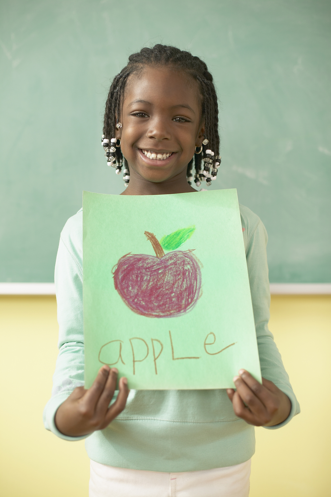 school girl with apple drawing