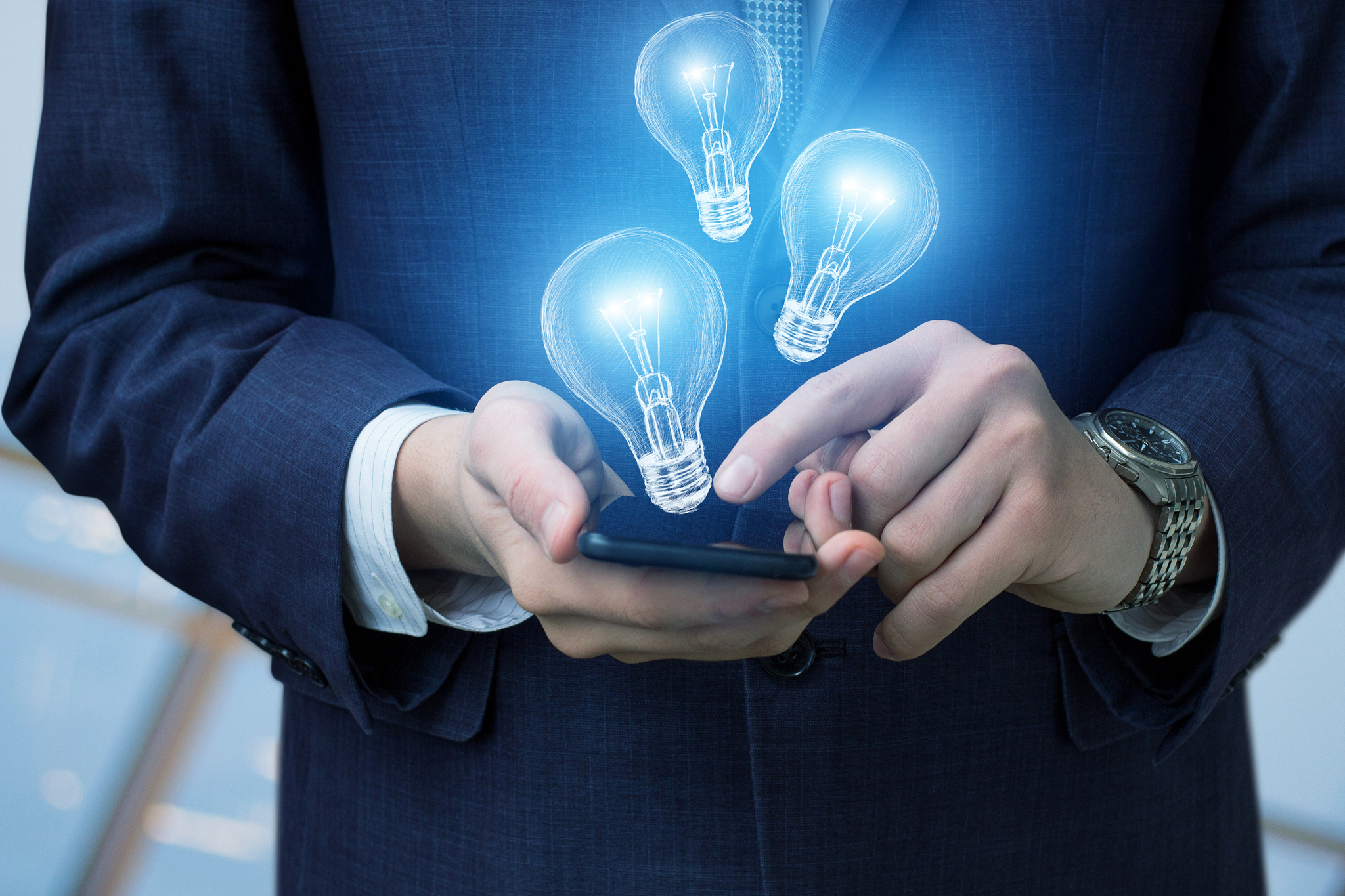 businessman with mobile and lights lamps.