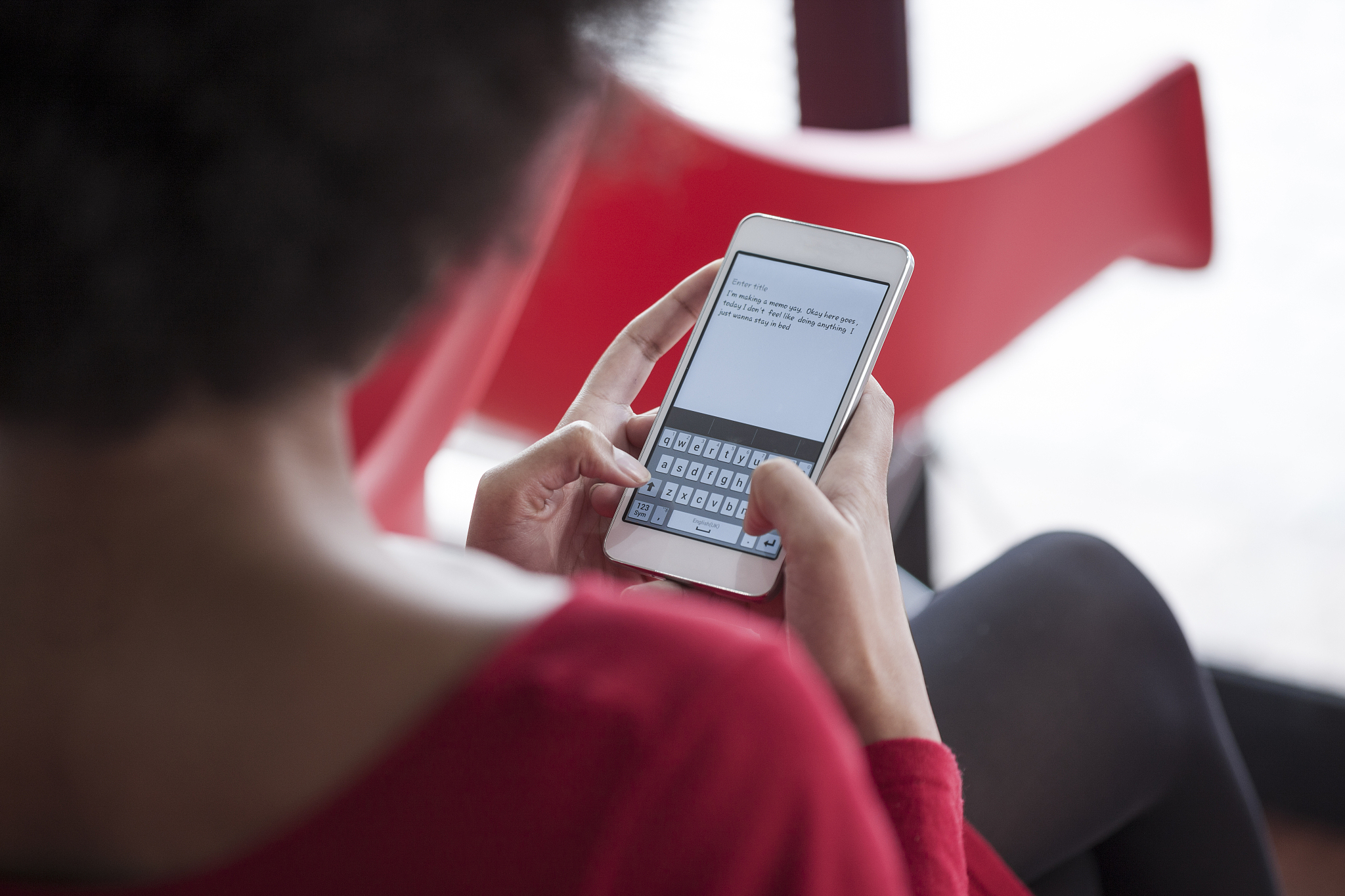woman text messaging on cell phone