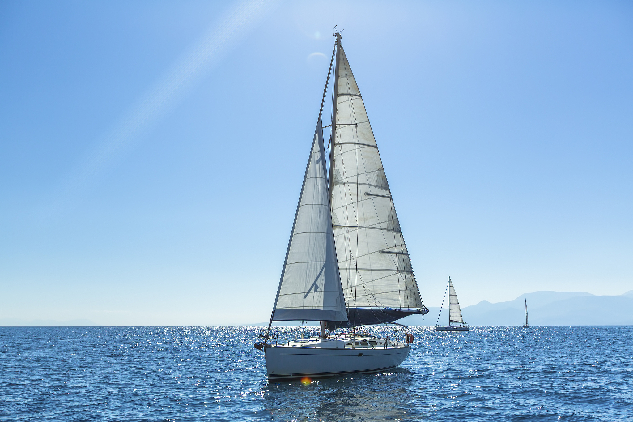 ship yachts with white sails in the open sea. sailing.