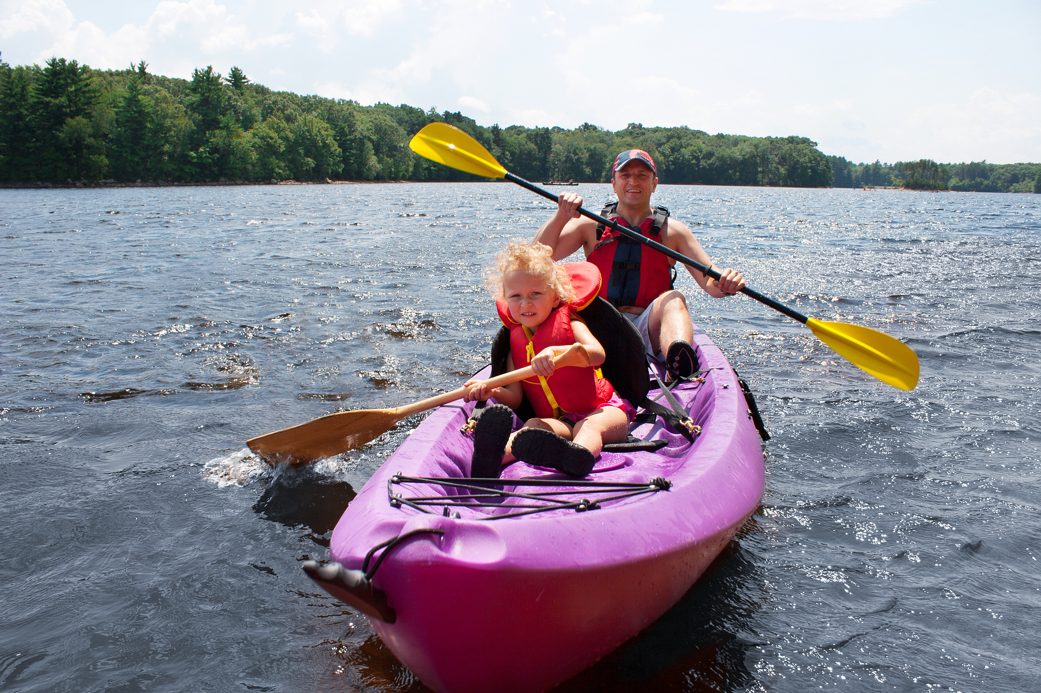 father and daughter kayaking