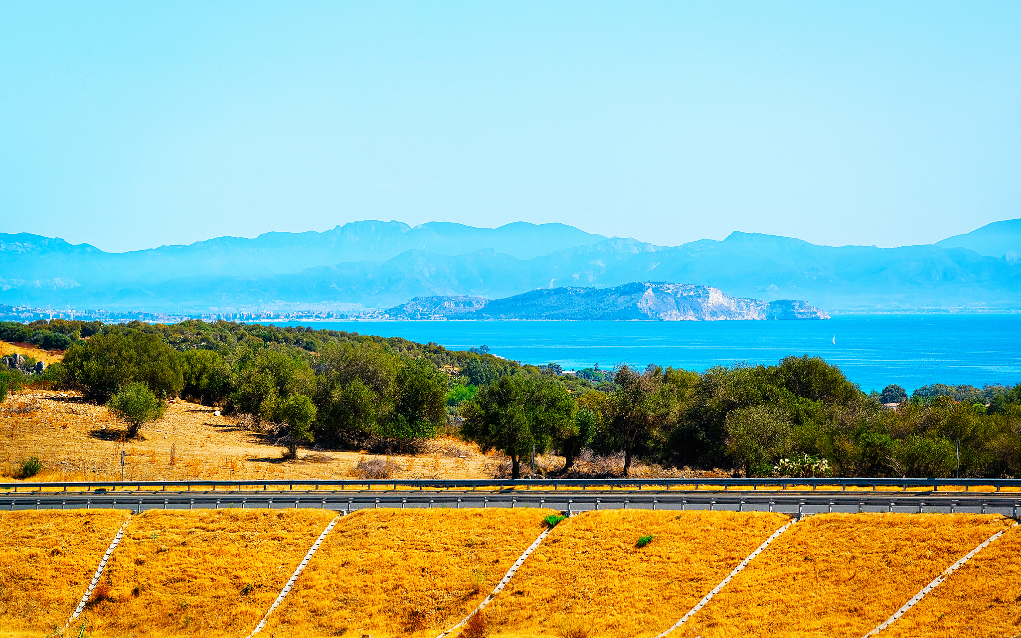 empty road without cars in sardinia island with mediterranean se