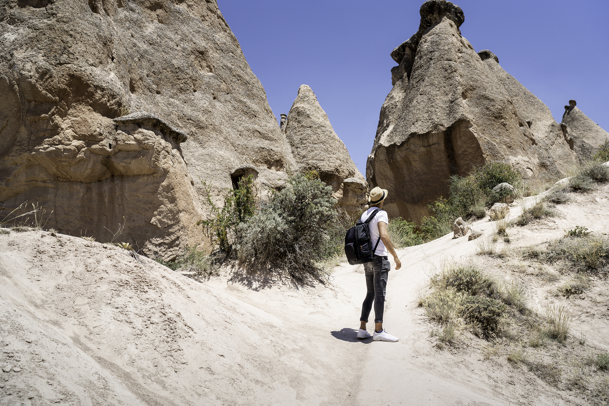 rear view of a young man exploring goreme