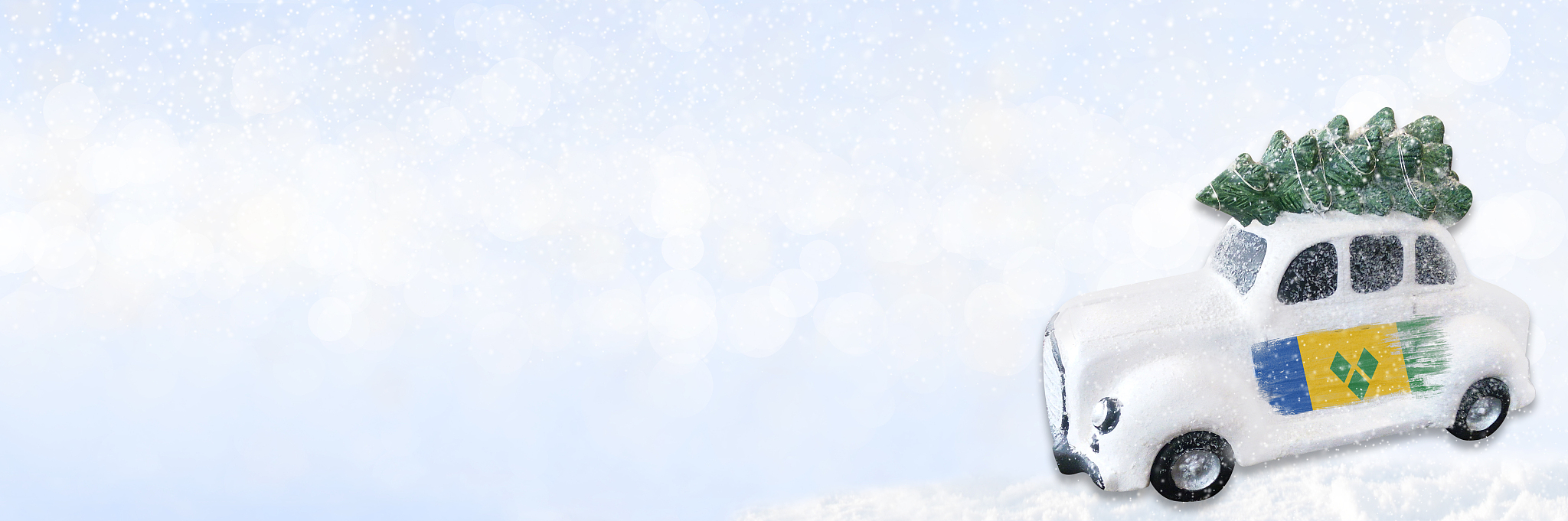 a miniature white christmas car with a flag of saint vincent and