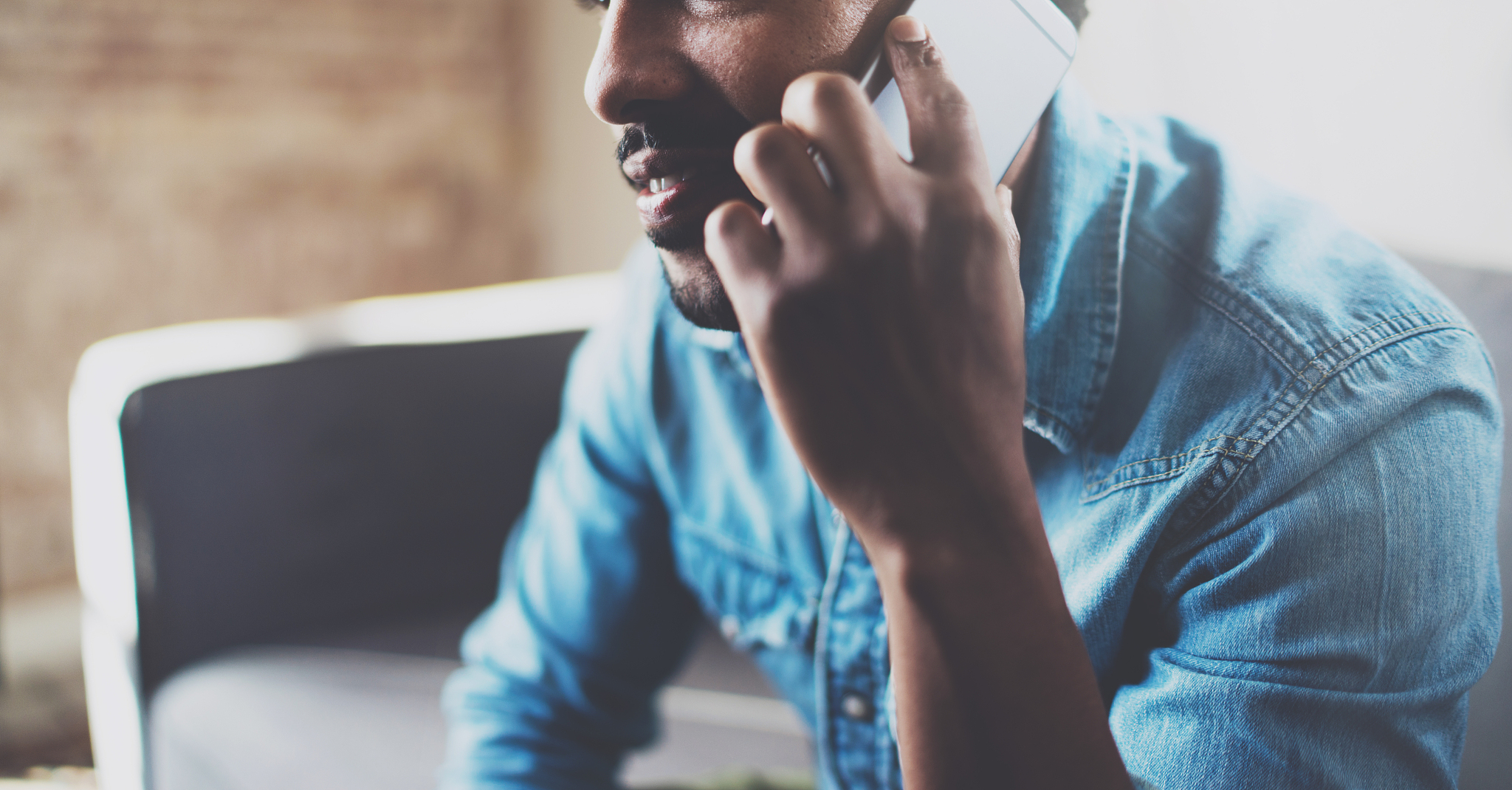 closeup view of young bearded african man making conversation on