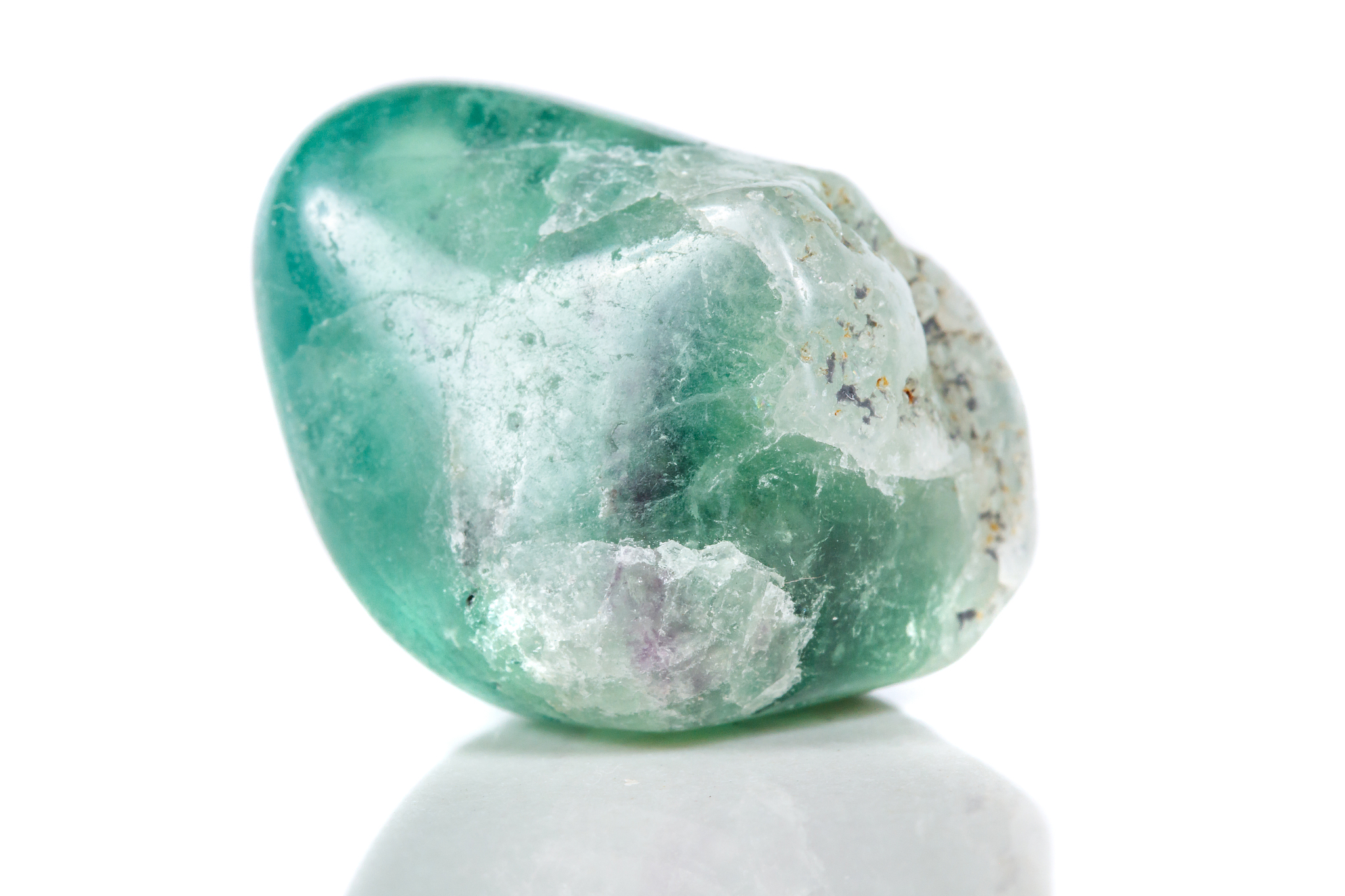 macro mineral stone fluorite crystal on a black background