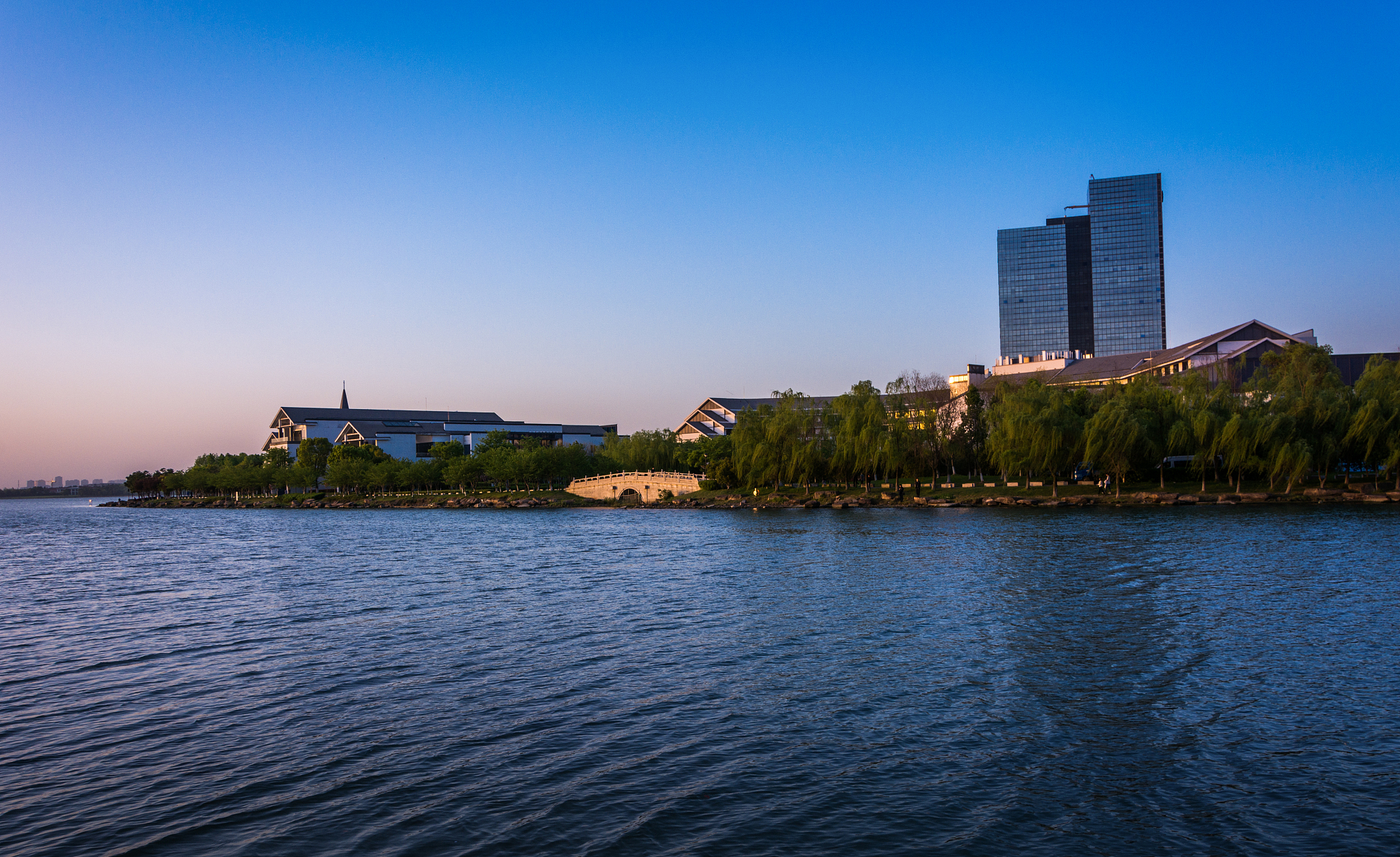 office building near the lake in sunset