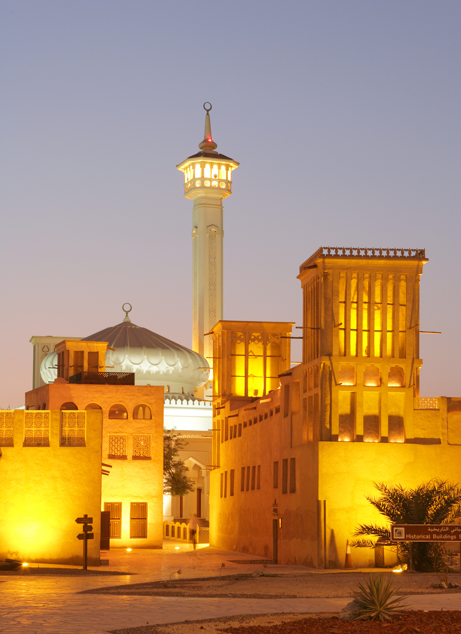 a mosque and wind towers in the historic area of bastakiya in du