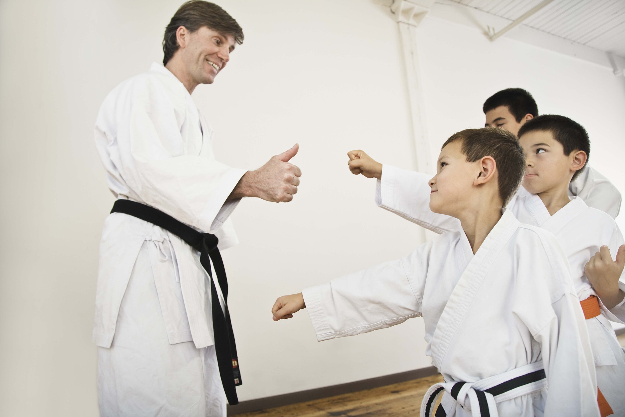 boys with teacher in karate class