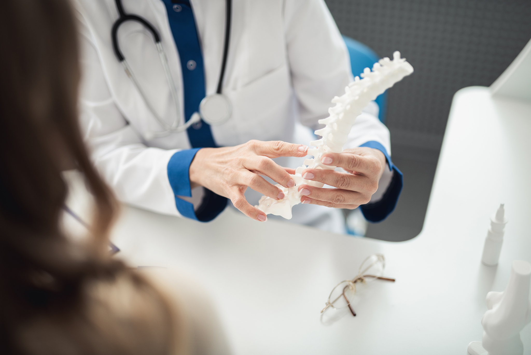 medical consultation of woman by doctor in clinic