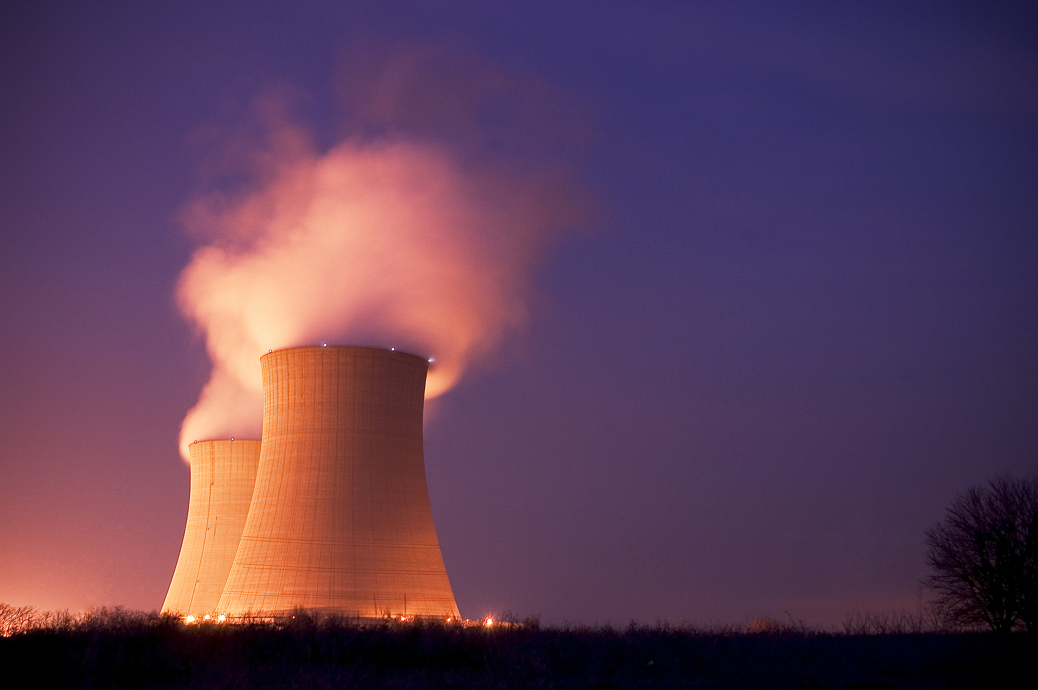 nuclear power plant cooling towers at dusk
