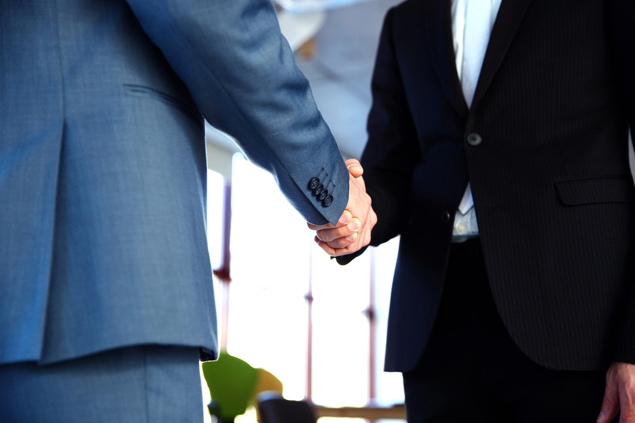 two businessman handshaking