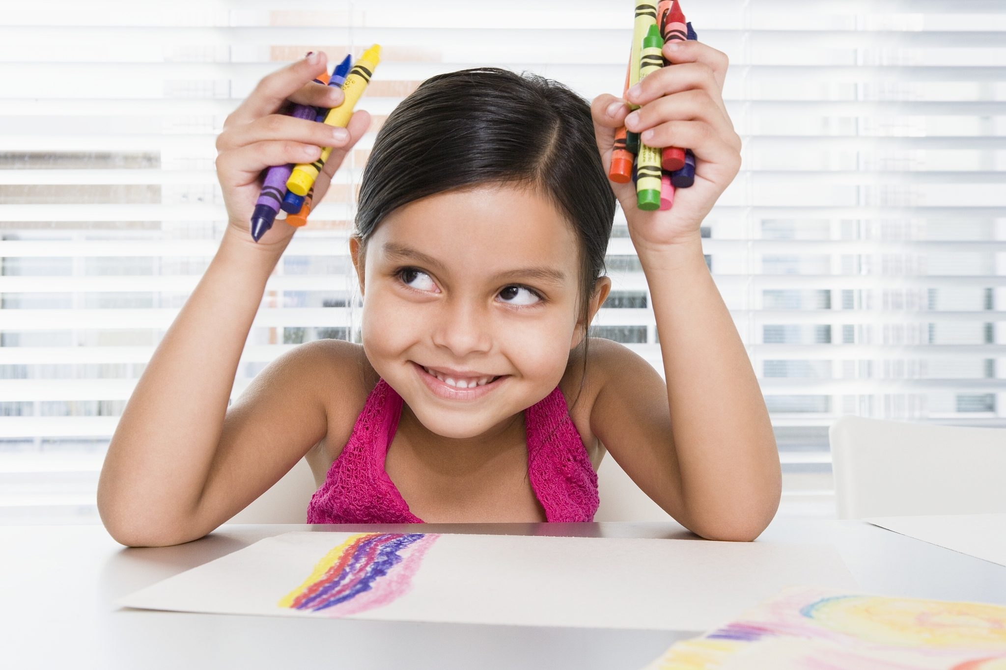 young girl with crayons