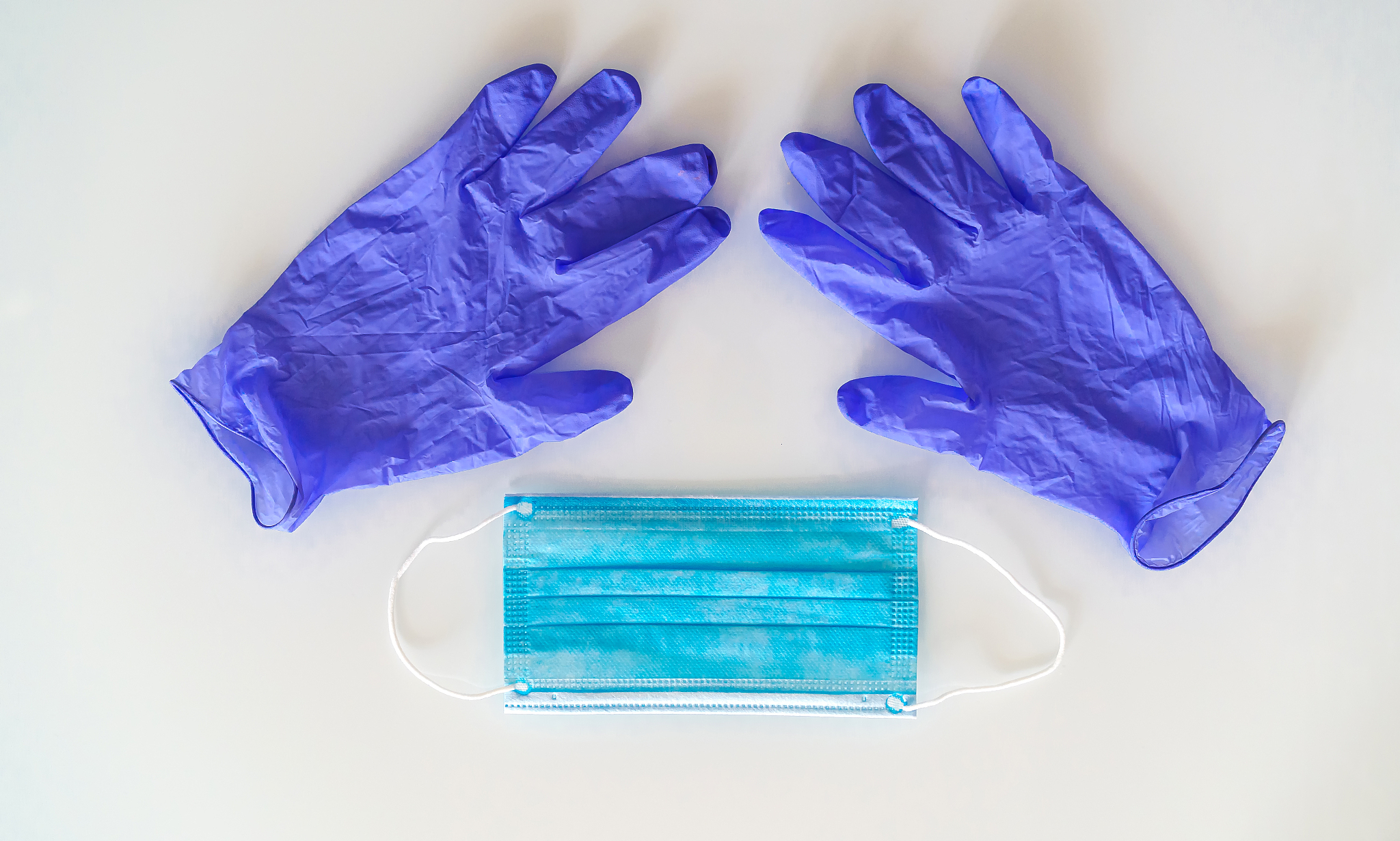 blue disposable medical face mask and pair of nitrile powder fre