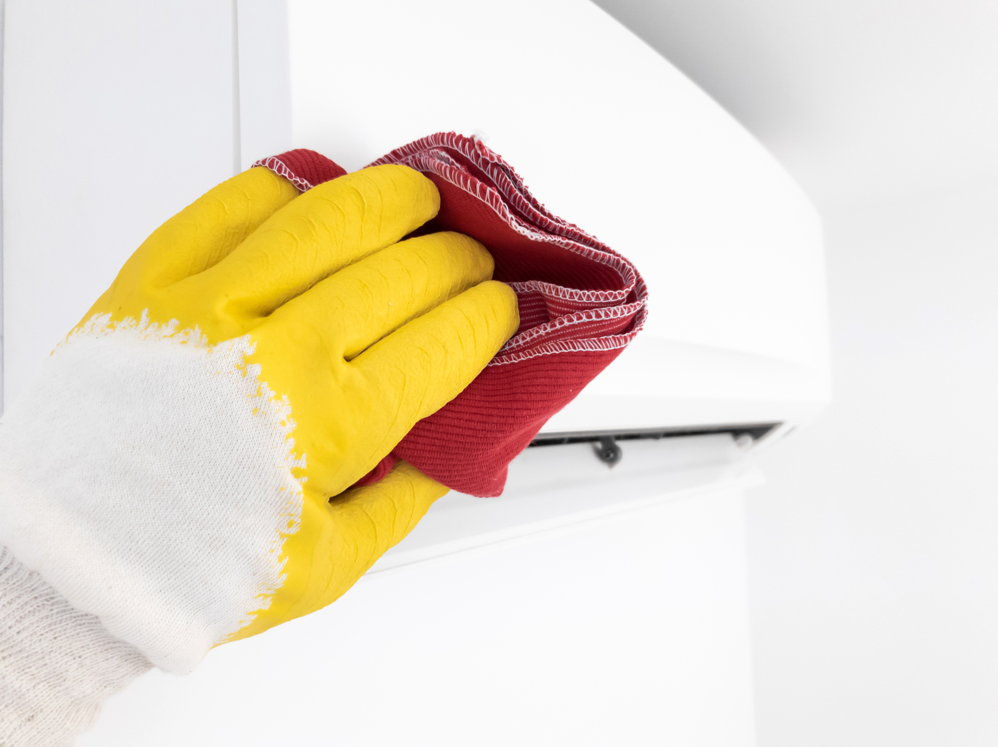 modern air conditioner unit service - cleaning the housing.