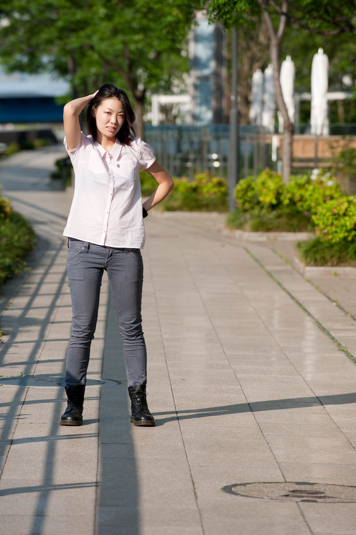 japanese girl poses on the street in tokyo, japan