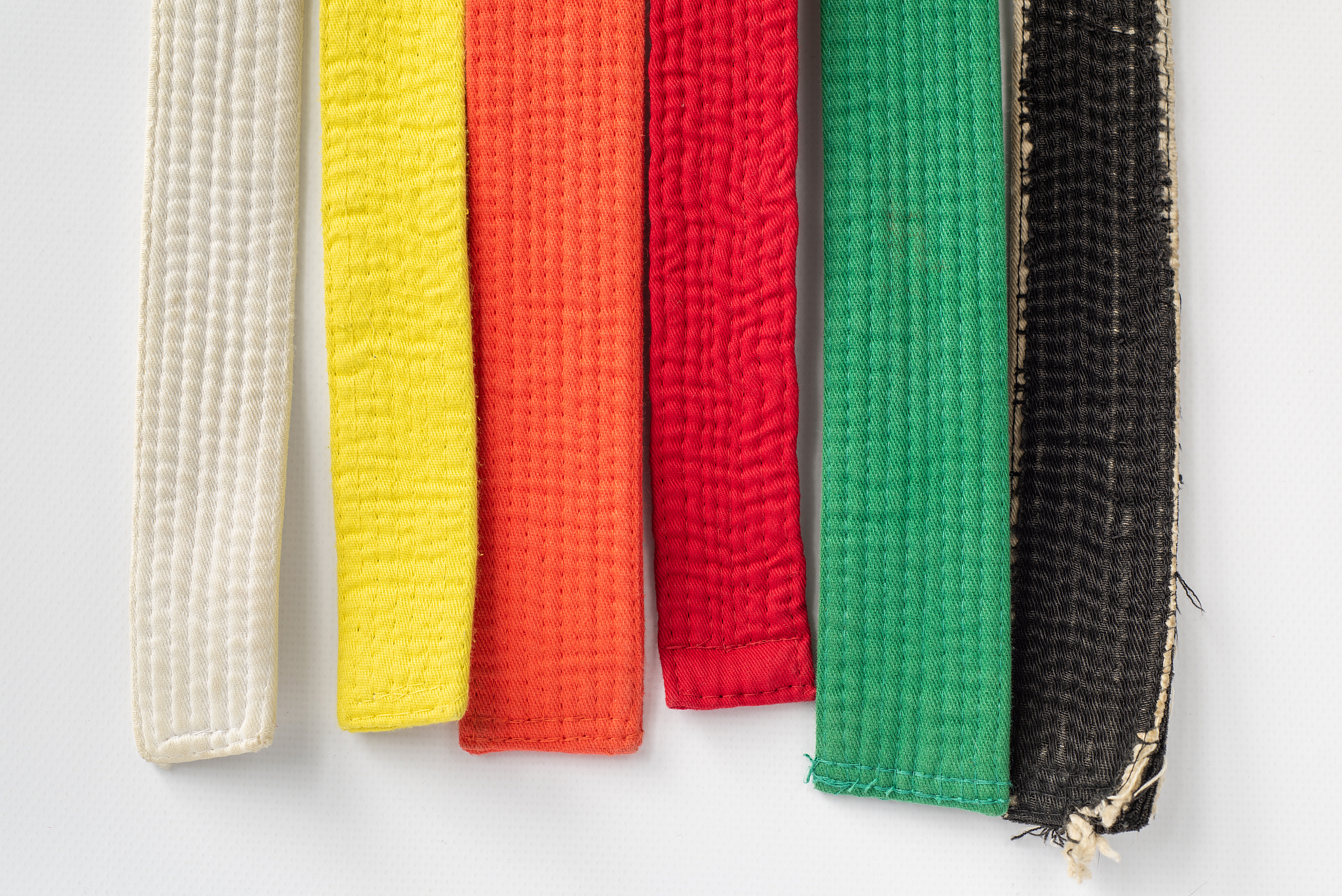 zen art. colored belts martial arts on white background. clothes