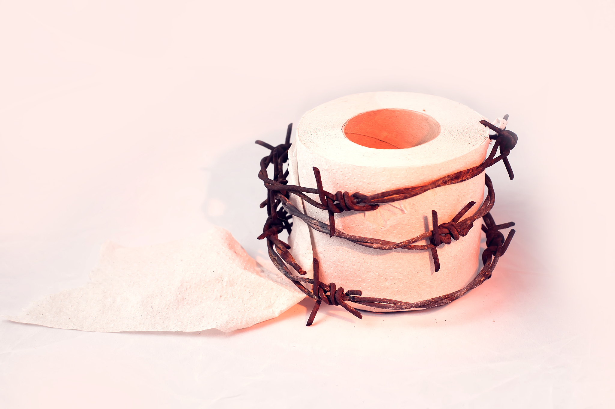 toilet paper with barbed wire around it. people, healthcare and 