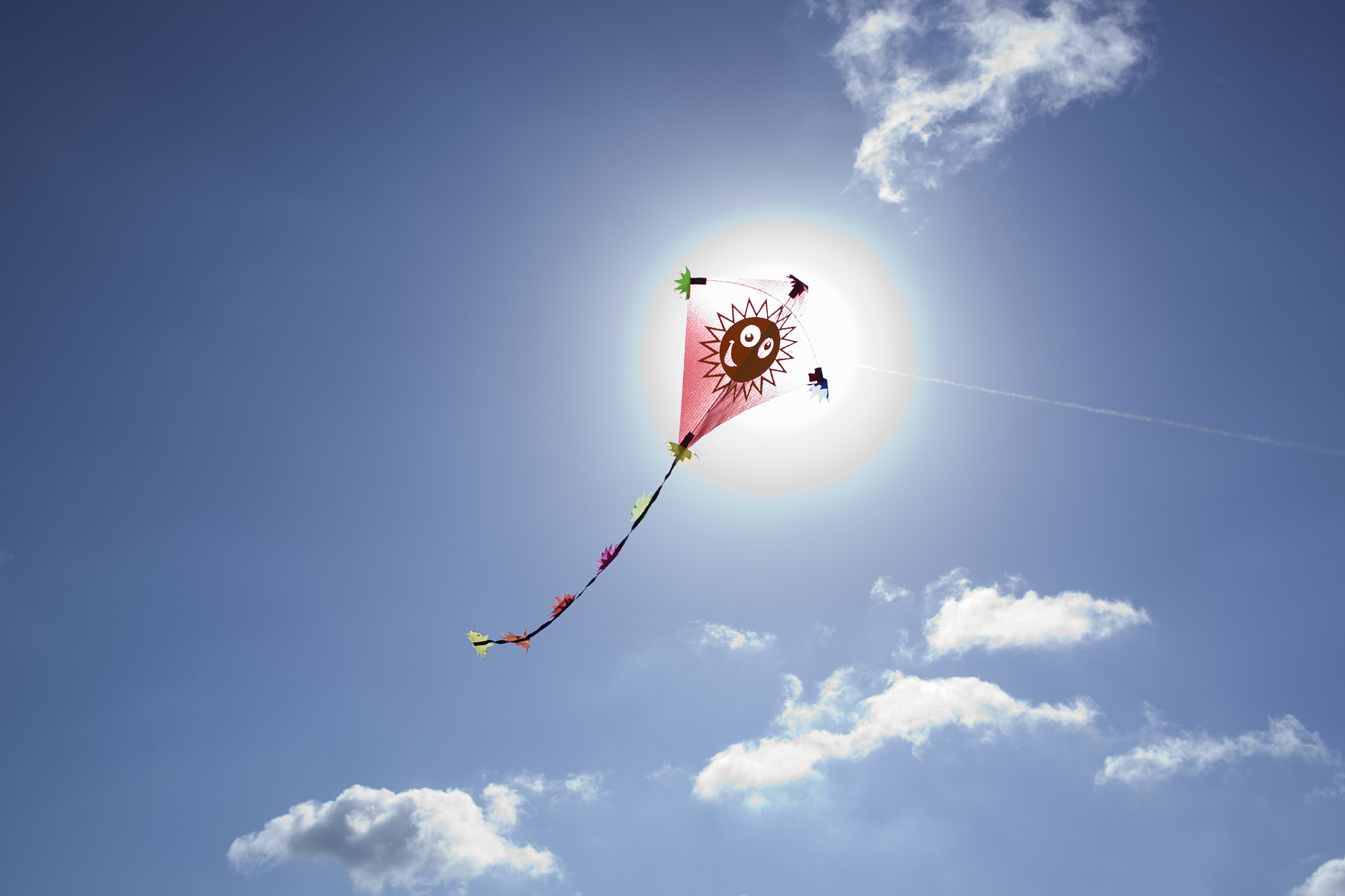 kite in front of the sun