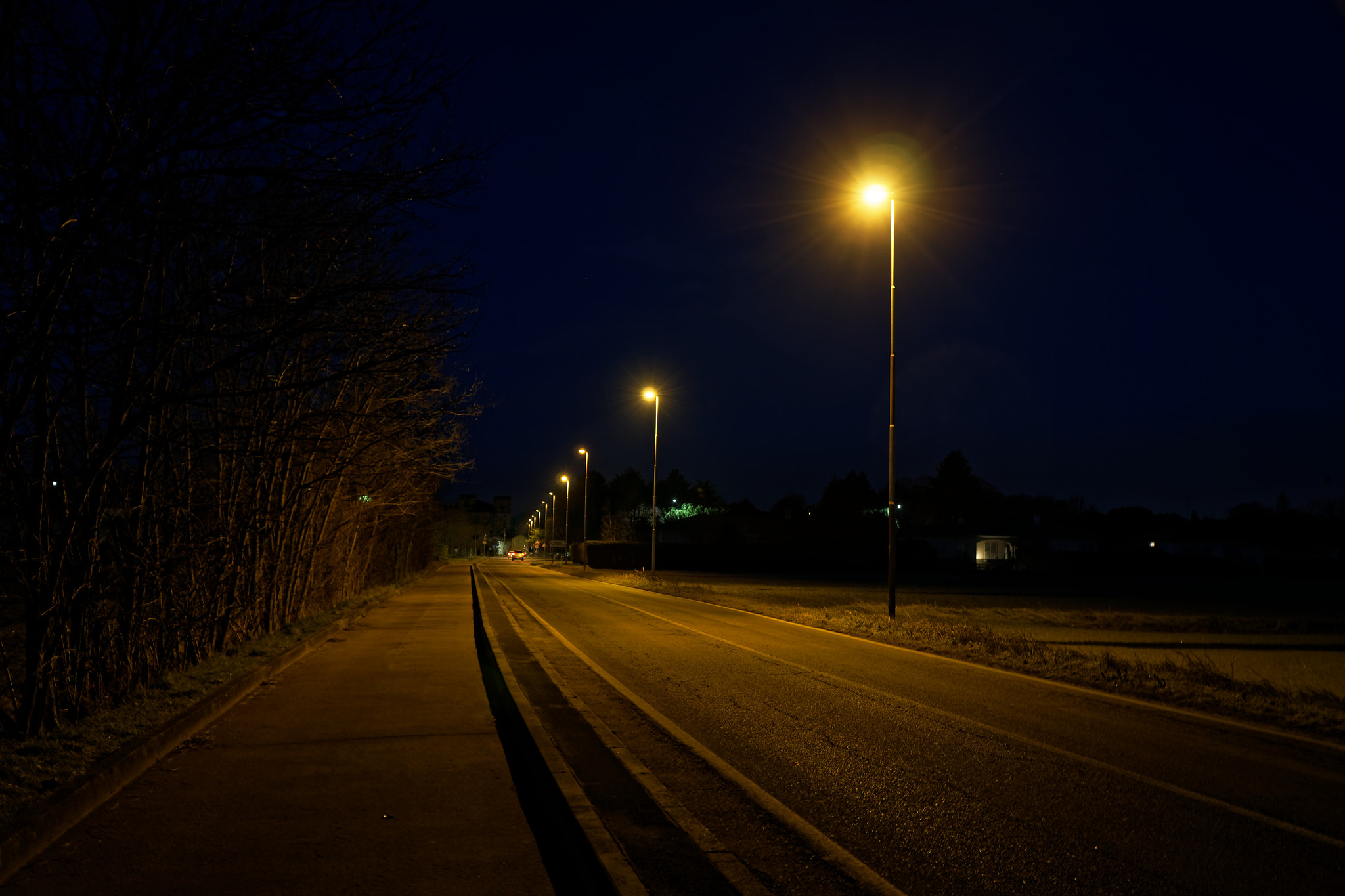 road lights in night, street post shadow