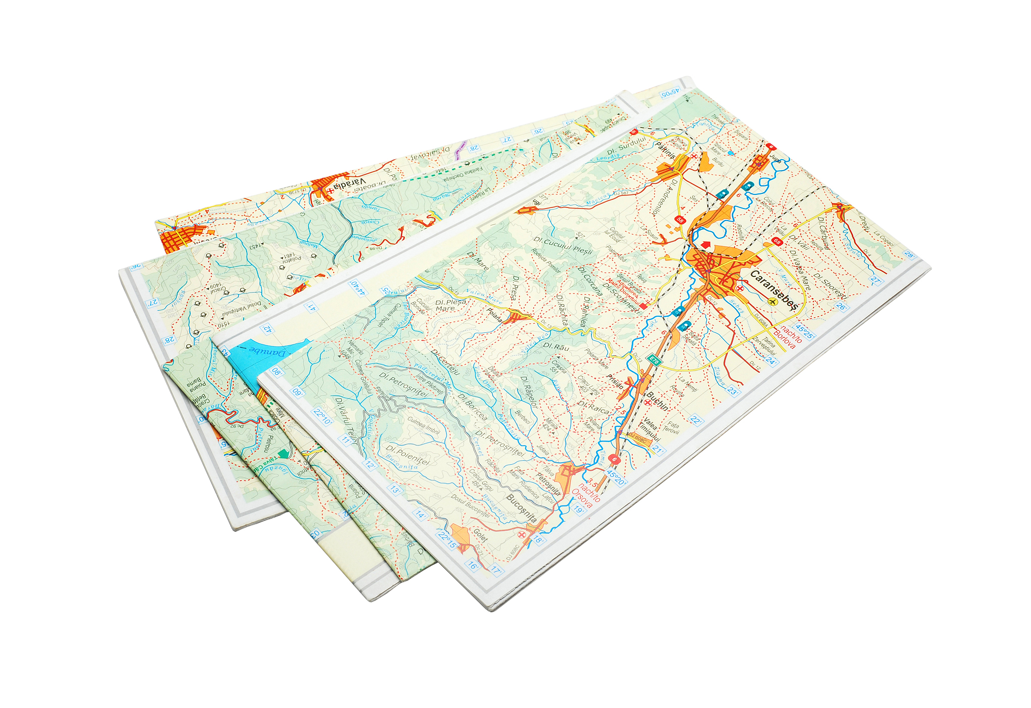 stack of folded maps on white background