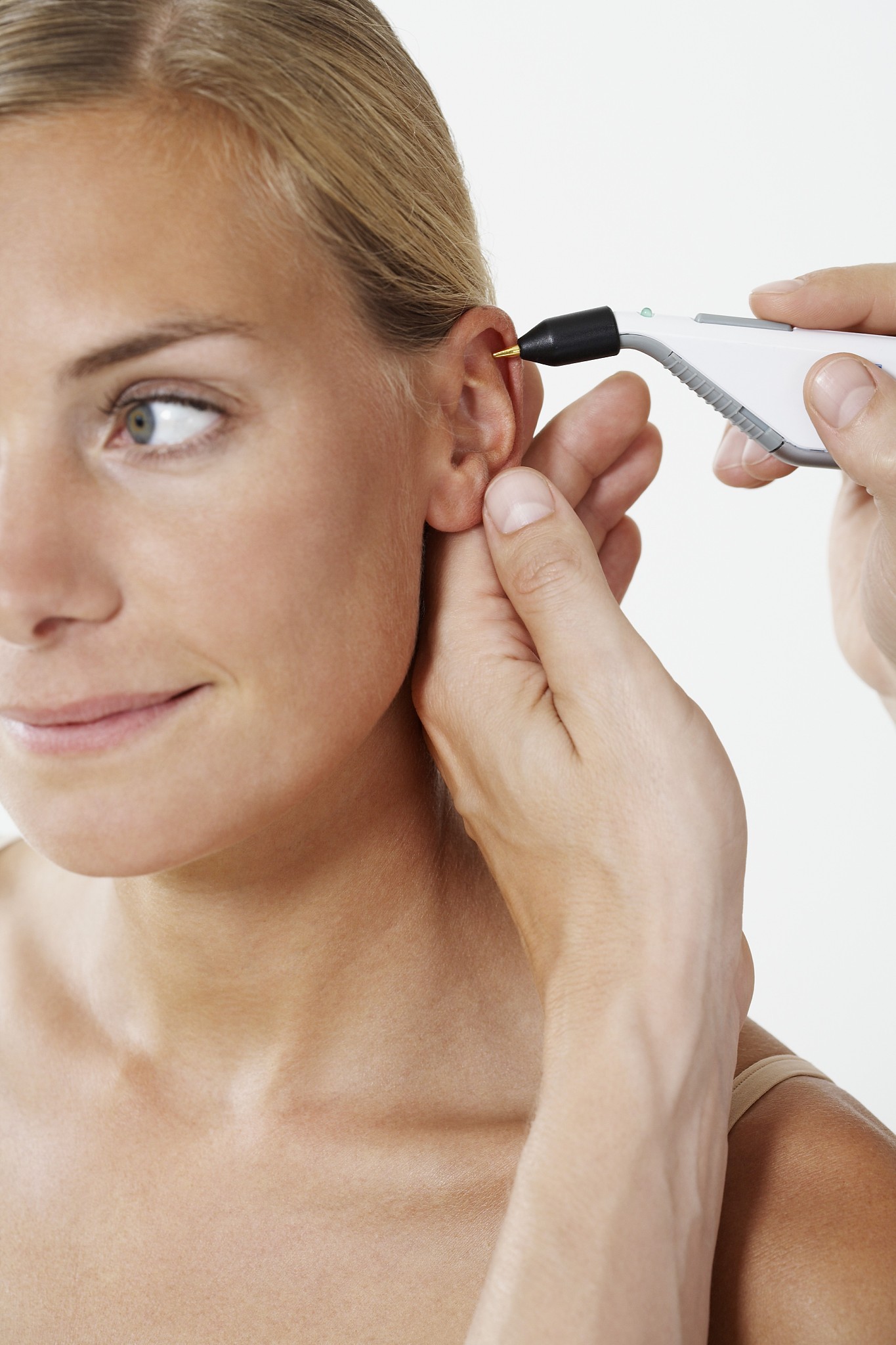 woman getting electro accupuncture in ear