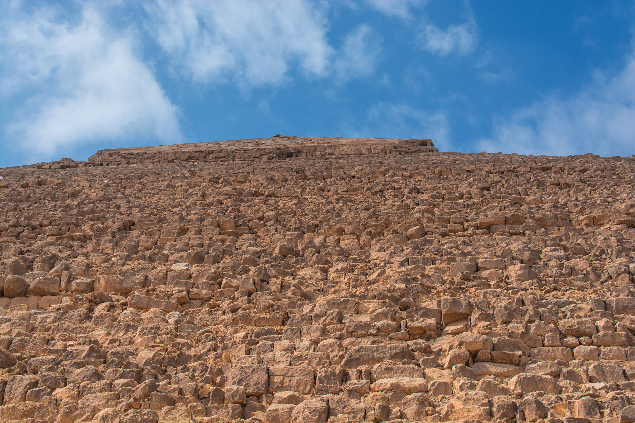 the sphinx of giza next to the pyramids in the desert, egypt
