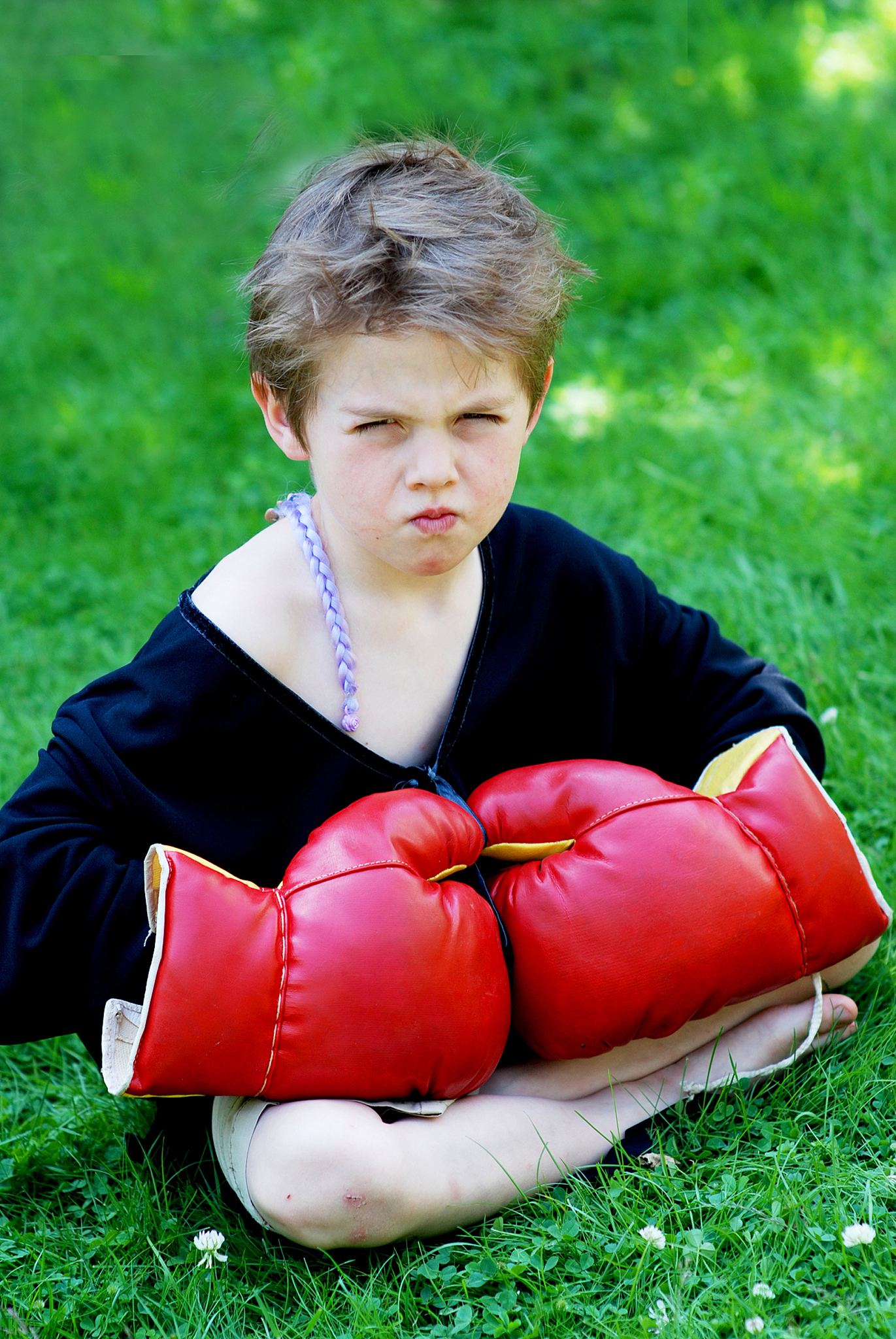 portrait of boy with boxing glove