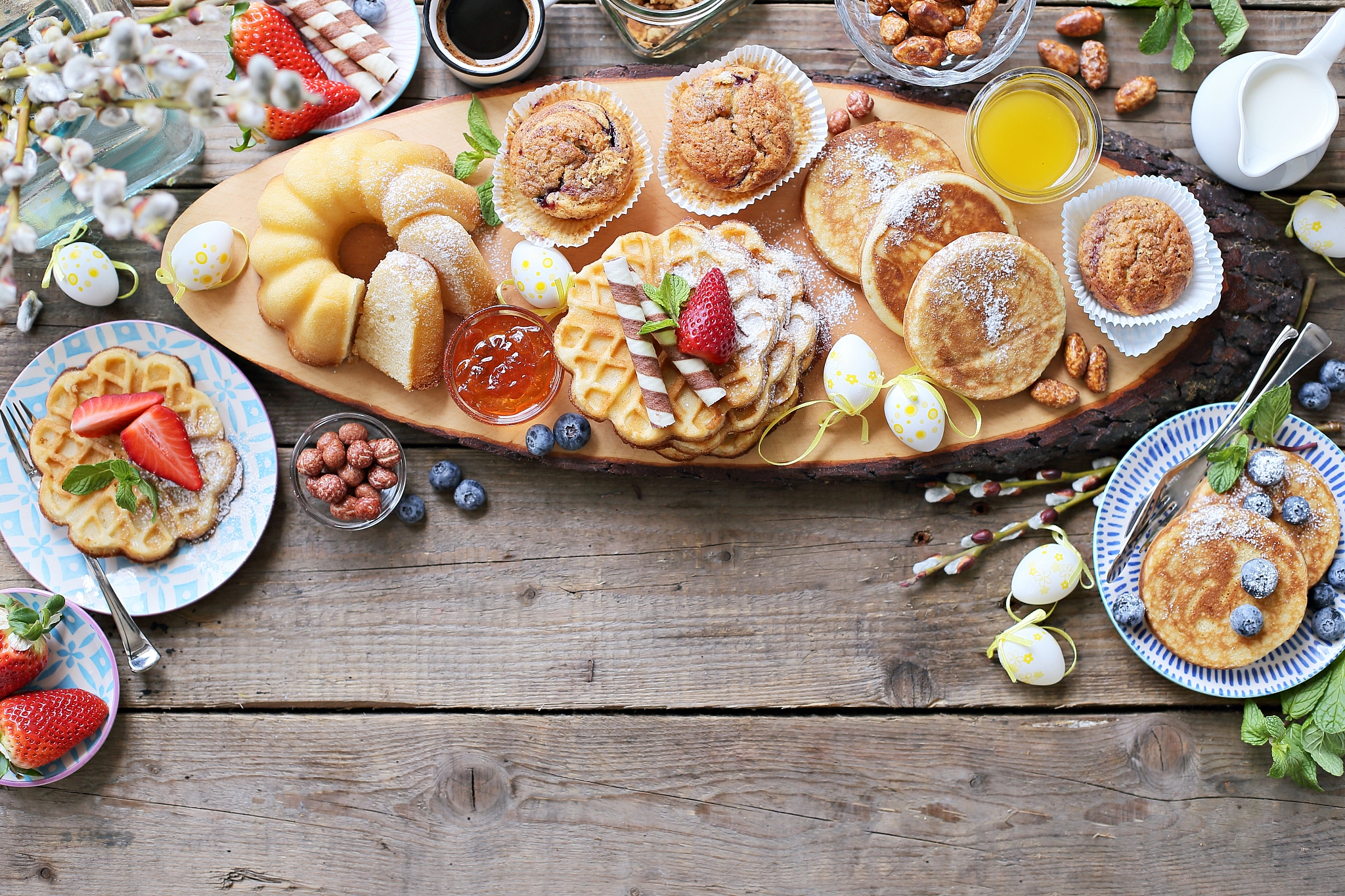 easter dessert table. pancakes,waffles and bundt cake with fresh