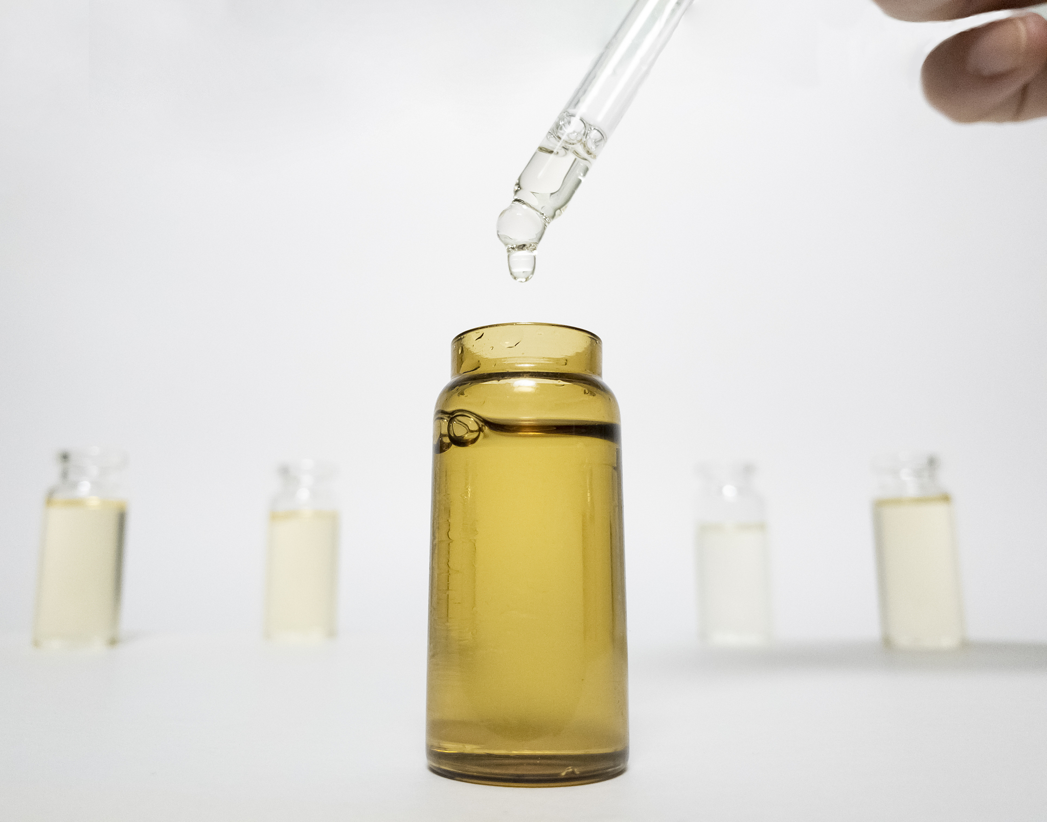 close up of dropper with cbd. cbd pipette.