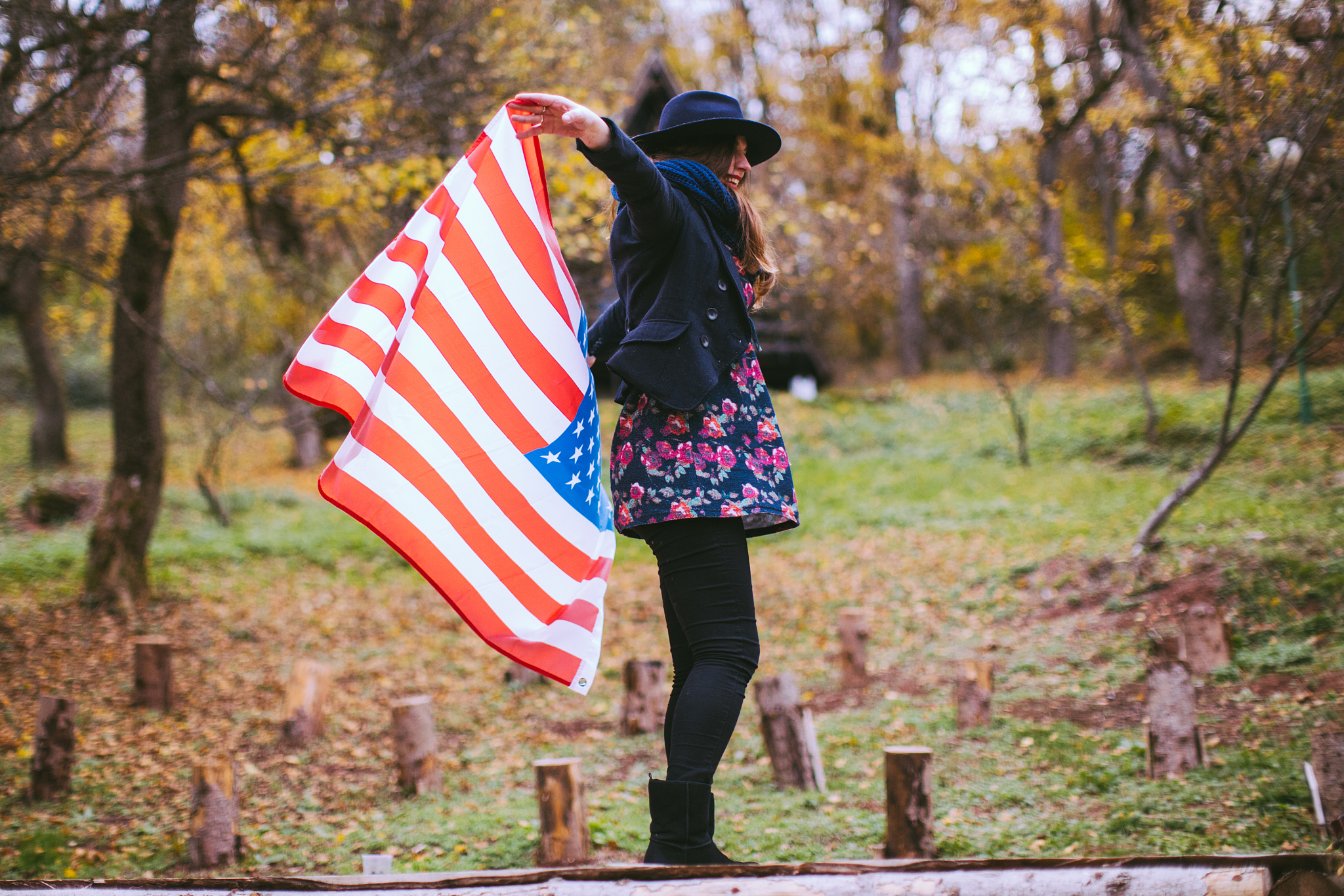 proud american girl holding u.s. flag